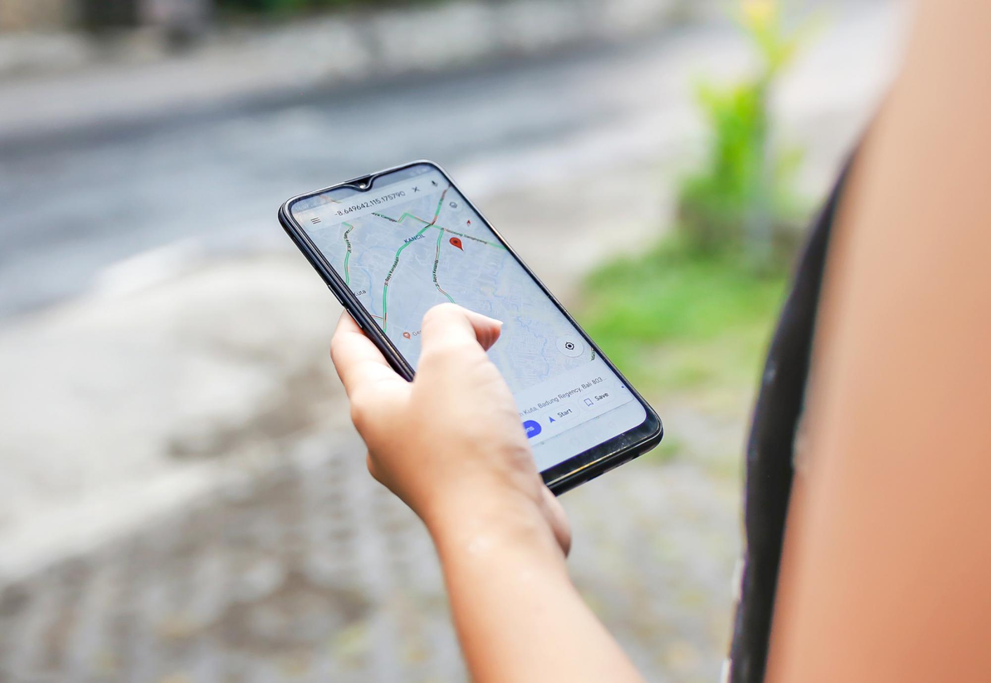 Woman using google maps to plan her journey