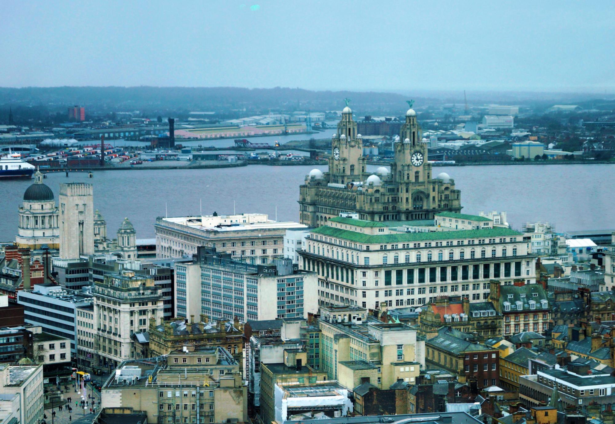 view of Liverpool and the Royal Liver Building on the river Mersey England.