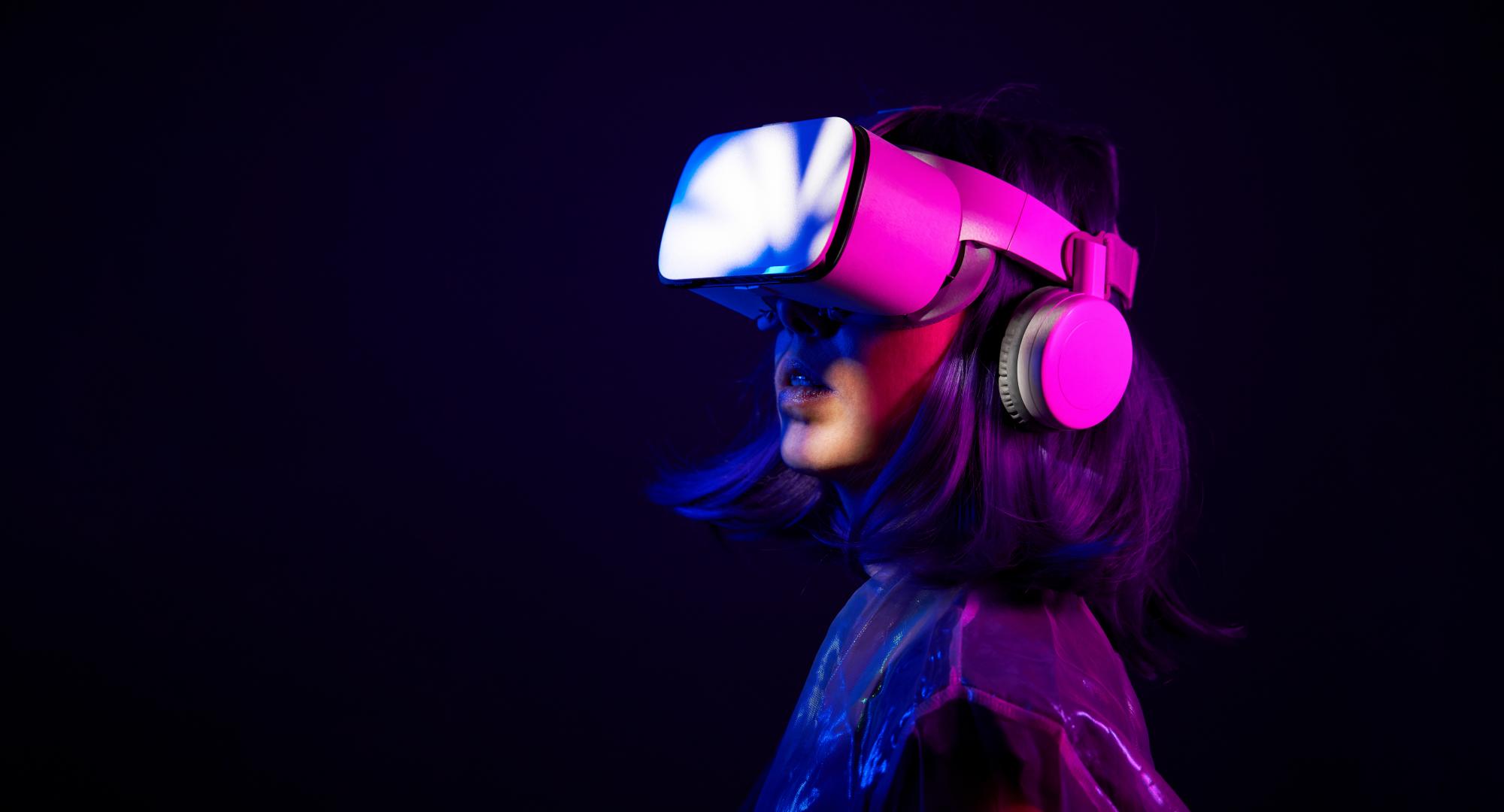 Woman in virtual reality goggle in neon colors