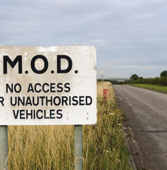 Sign warning public that a road belongs to the MOD and is private.