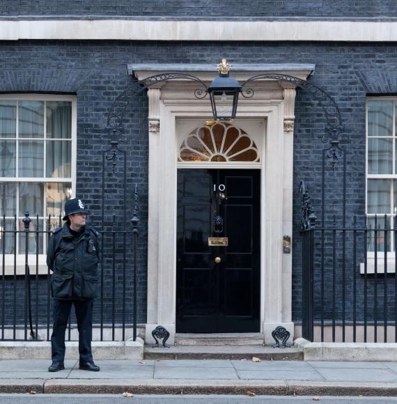 Policeman stands guard outside 10 Downing Street.