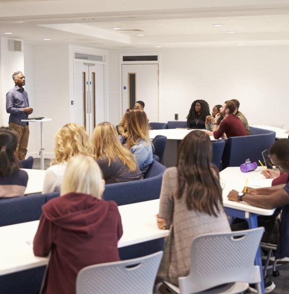 University students in a classroom with lecturer