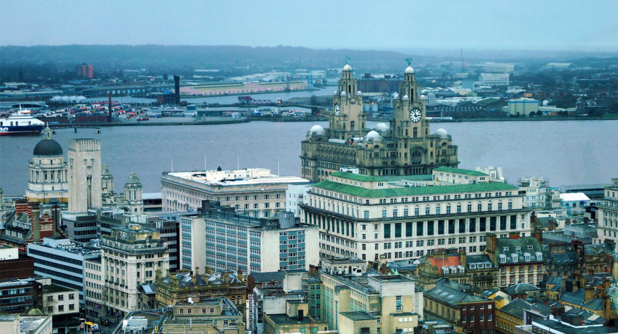 view of Liverpool and the Royal Liver Building on the river Mersey England.