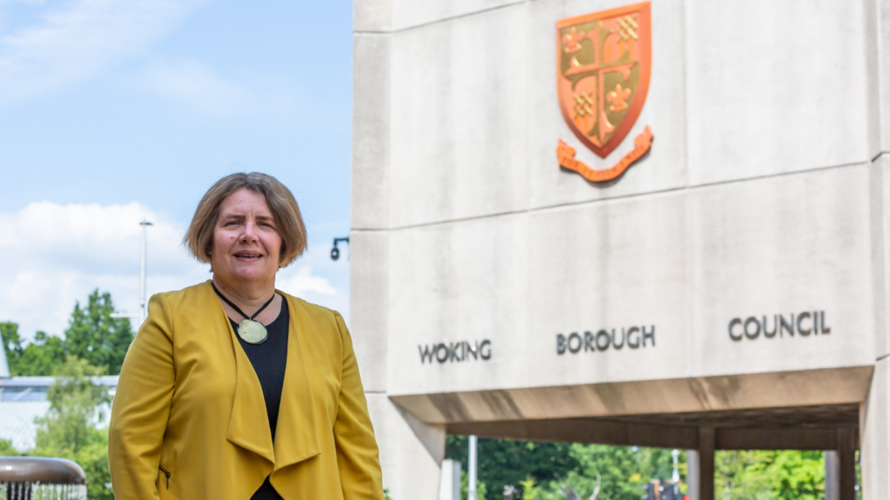 Image of Cllr Ann-Marie Baker in front of Woking council building