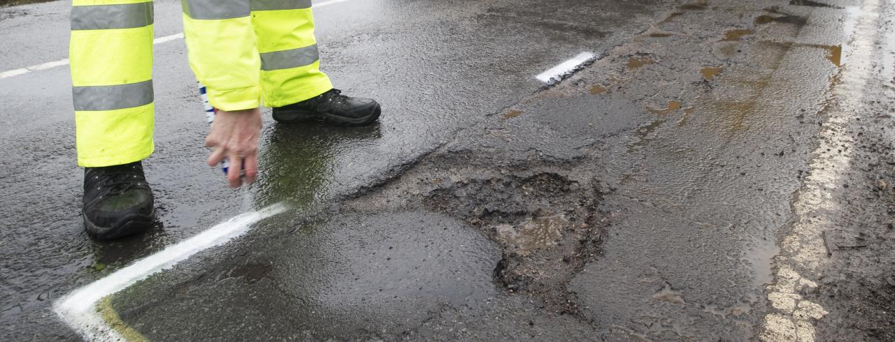 Man and pothole