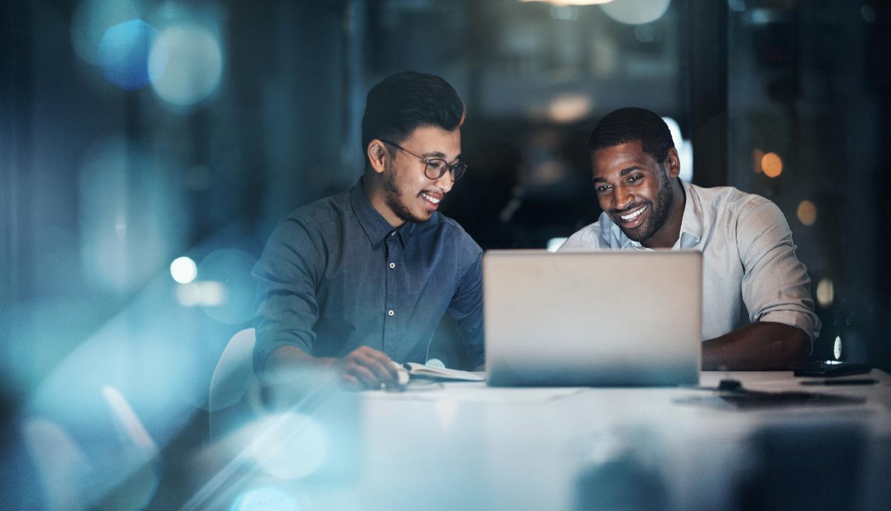 Public sector IT team discussing over a laptop