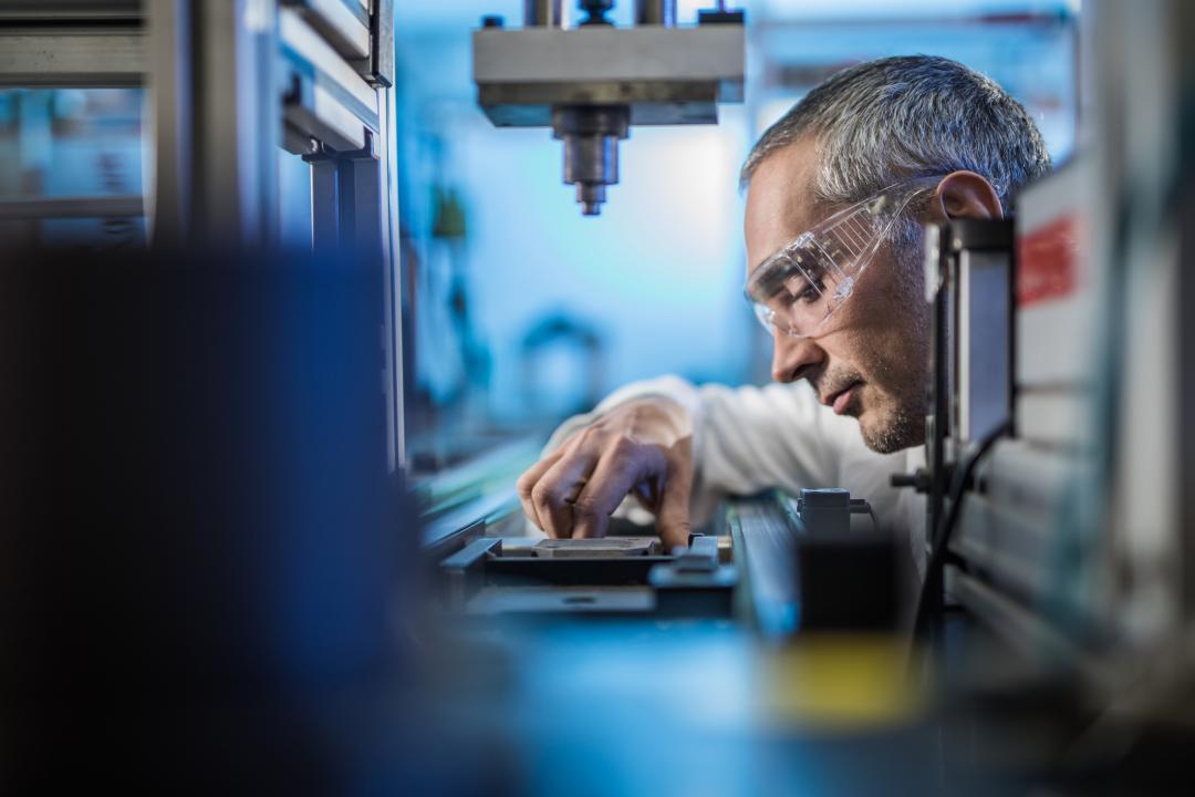 Manufacturing engineer looking at a machine