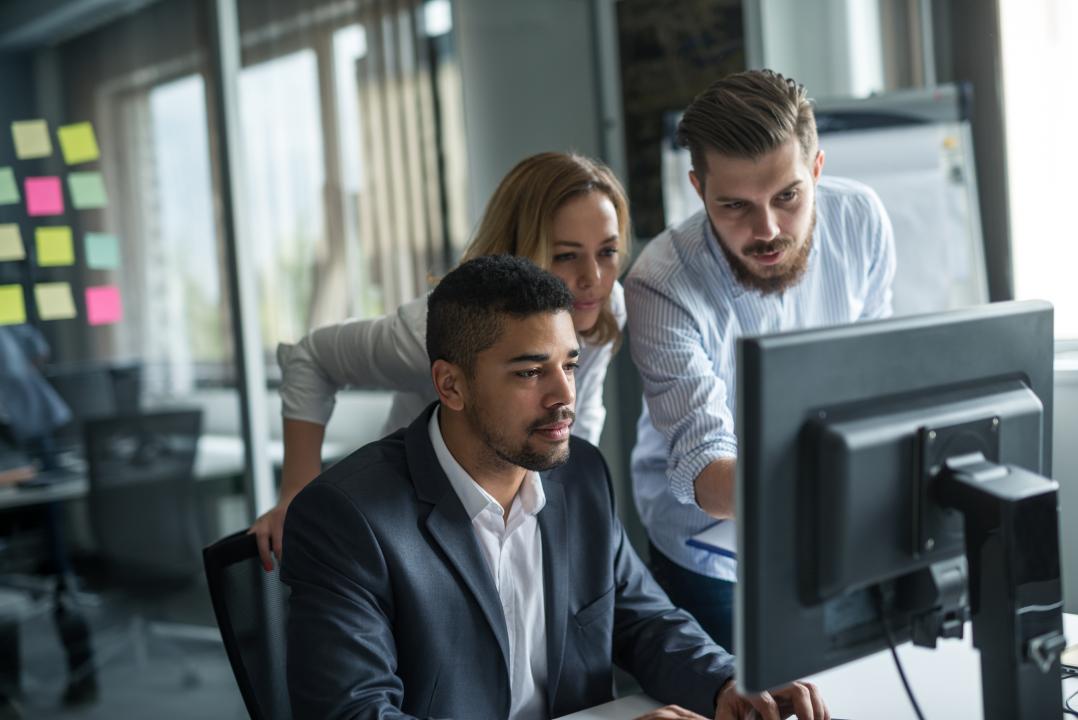 Team working from a computer desk