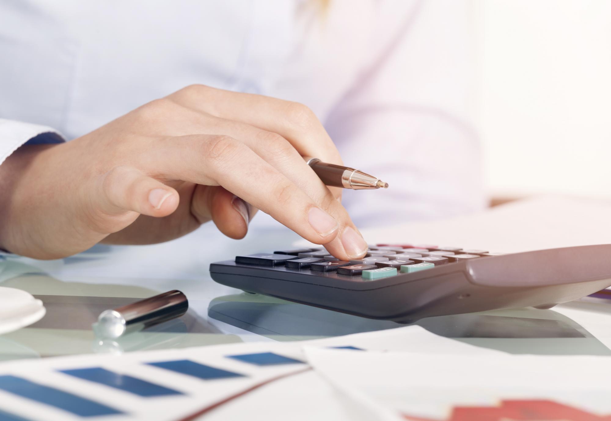 Businesswoman using calculator