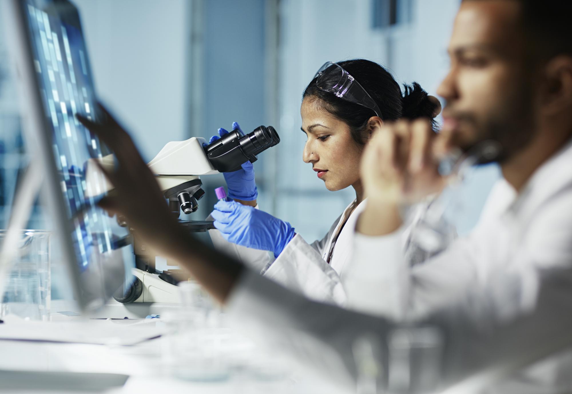 Scientist Working on Computer In Modern Laboratory