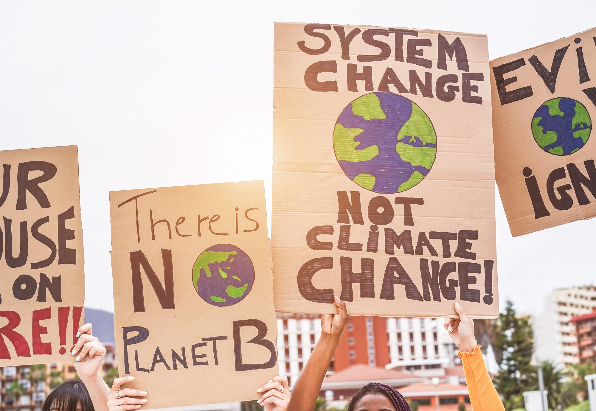 Group of demonstrators on road, young people from different culture and race fight for climate change.