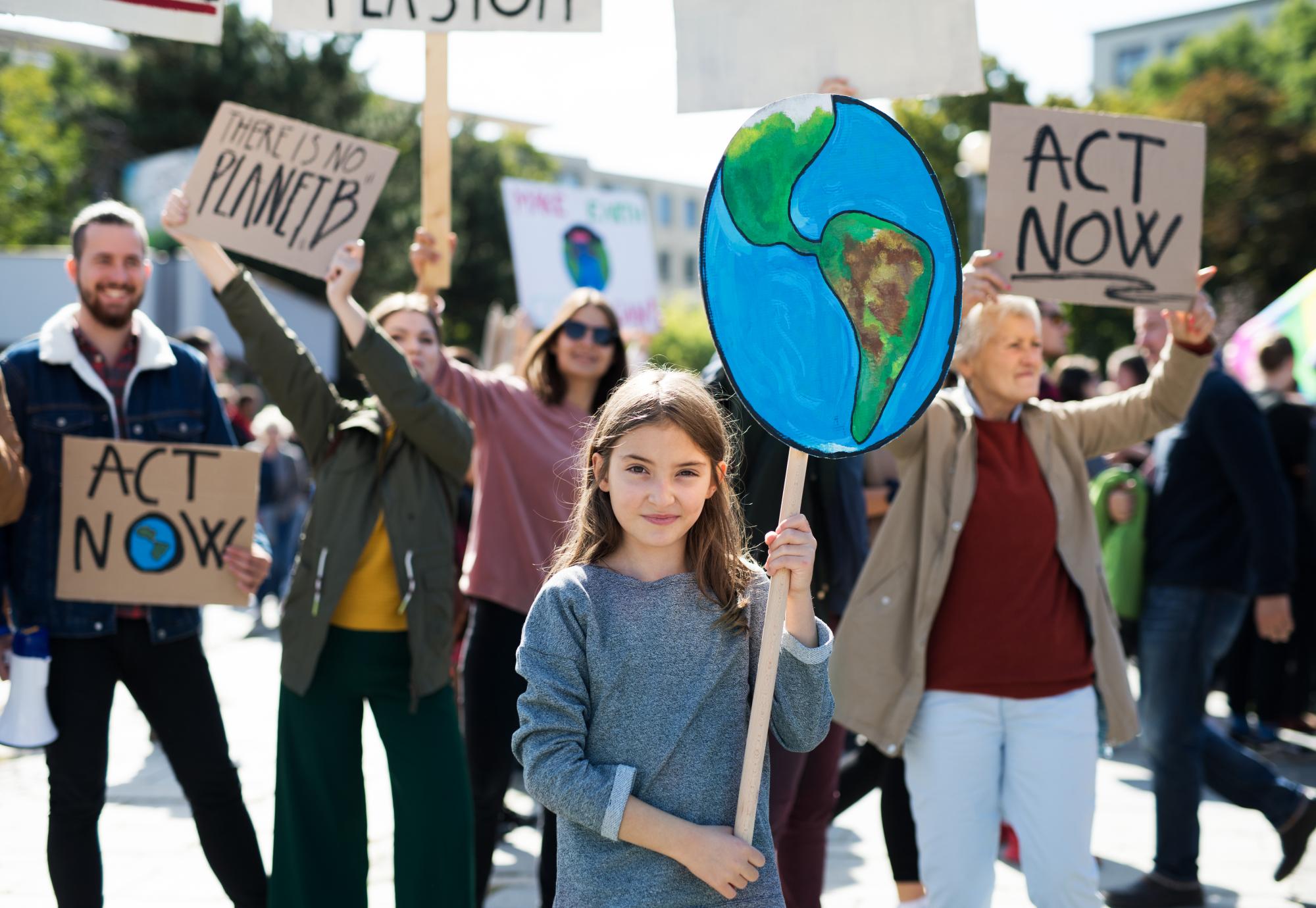 People with placards and posters on a global strike for climate change.