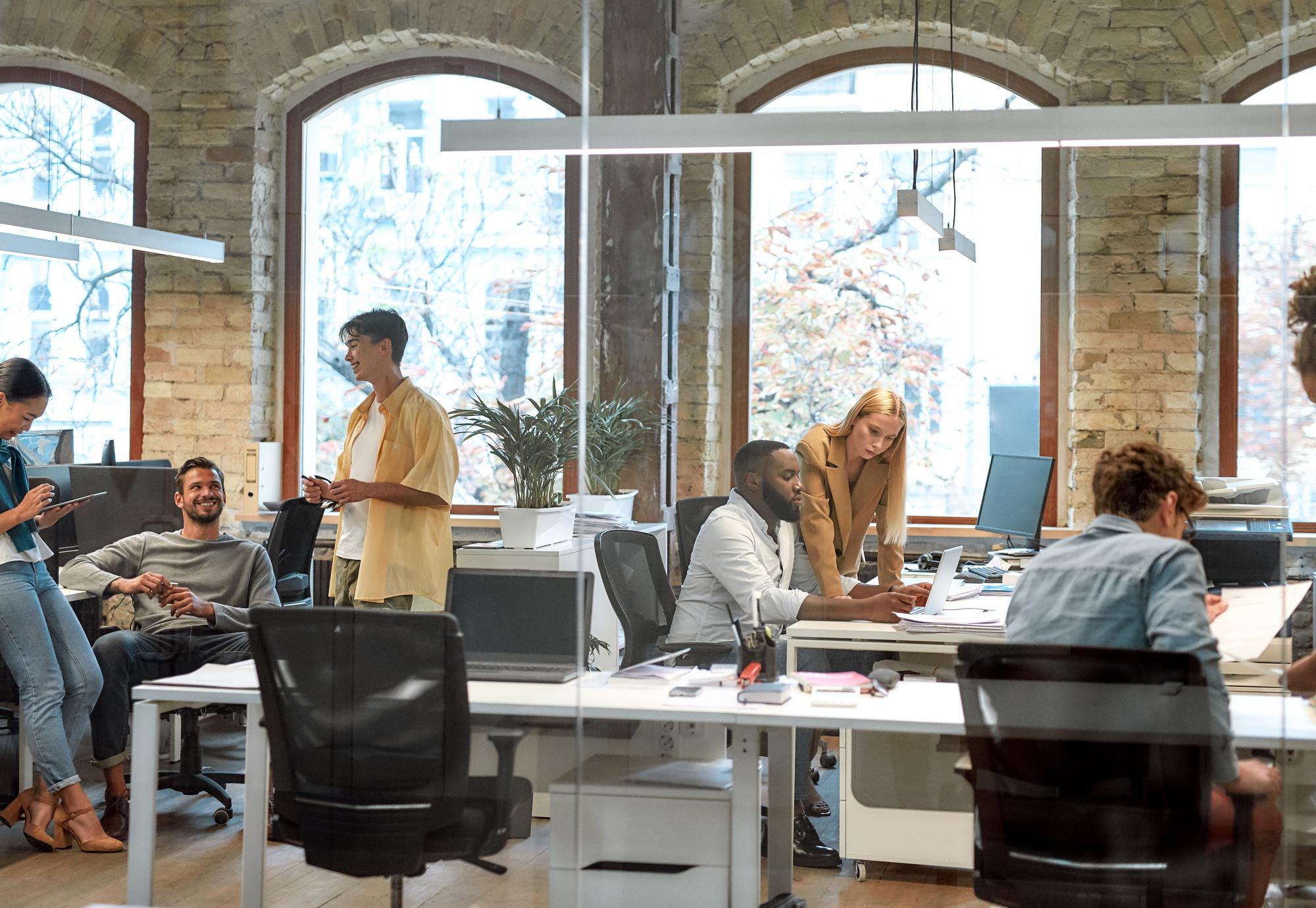 Group of mixed race business people working together in the creative office.