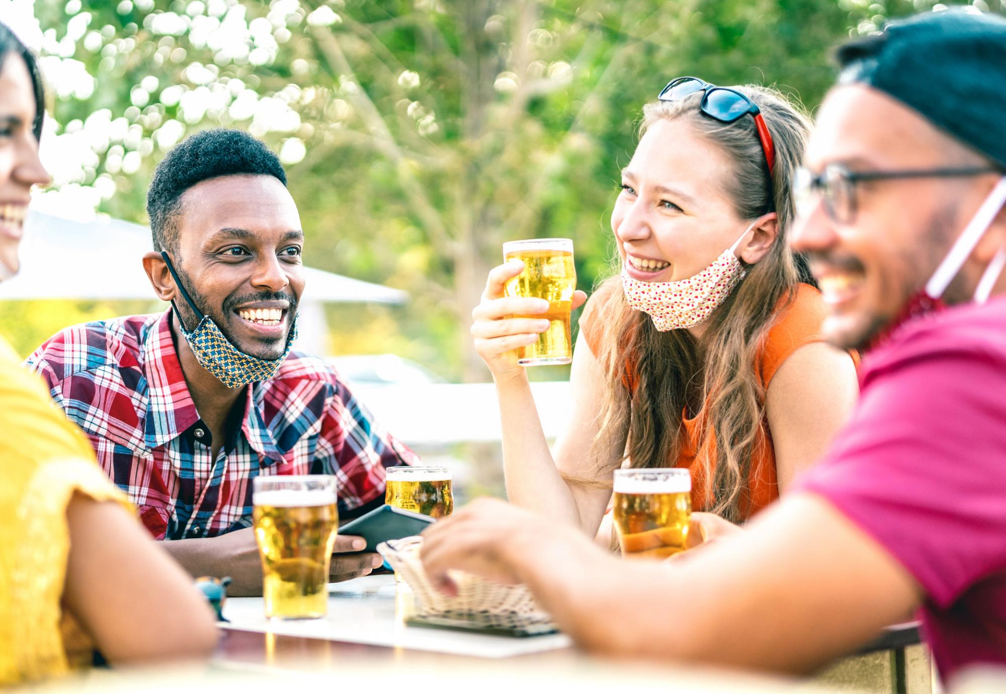 Friends laugh at dinner table