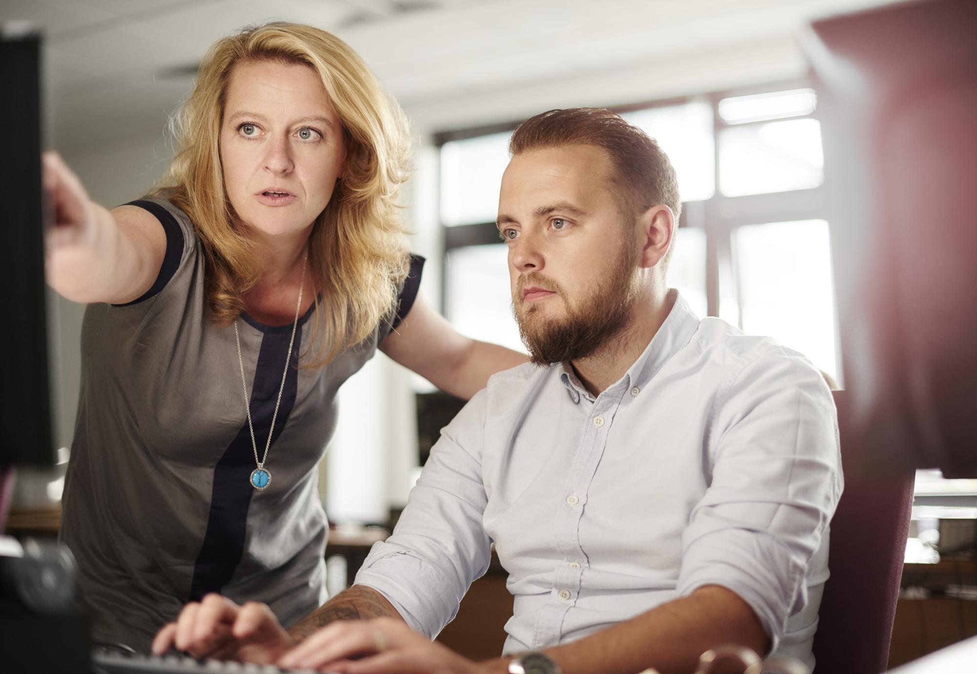 Teacher helping mature student