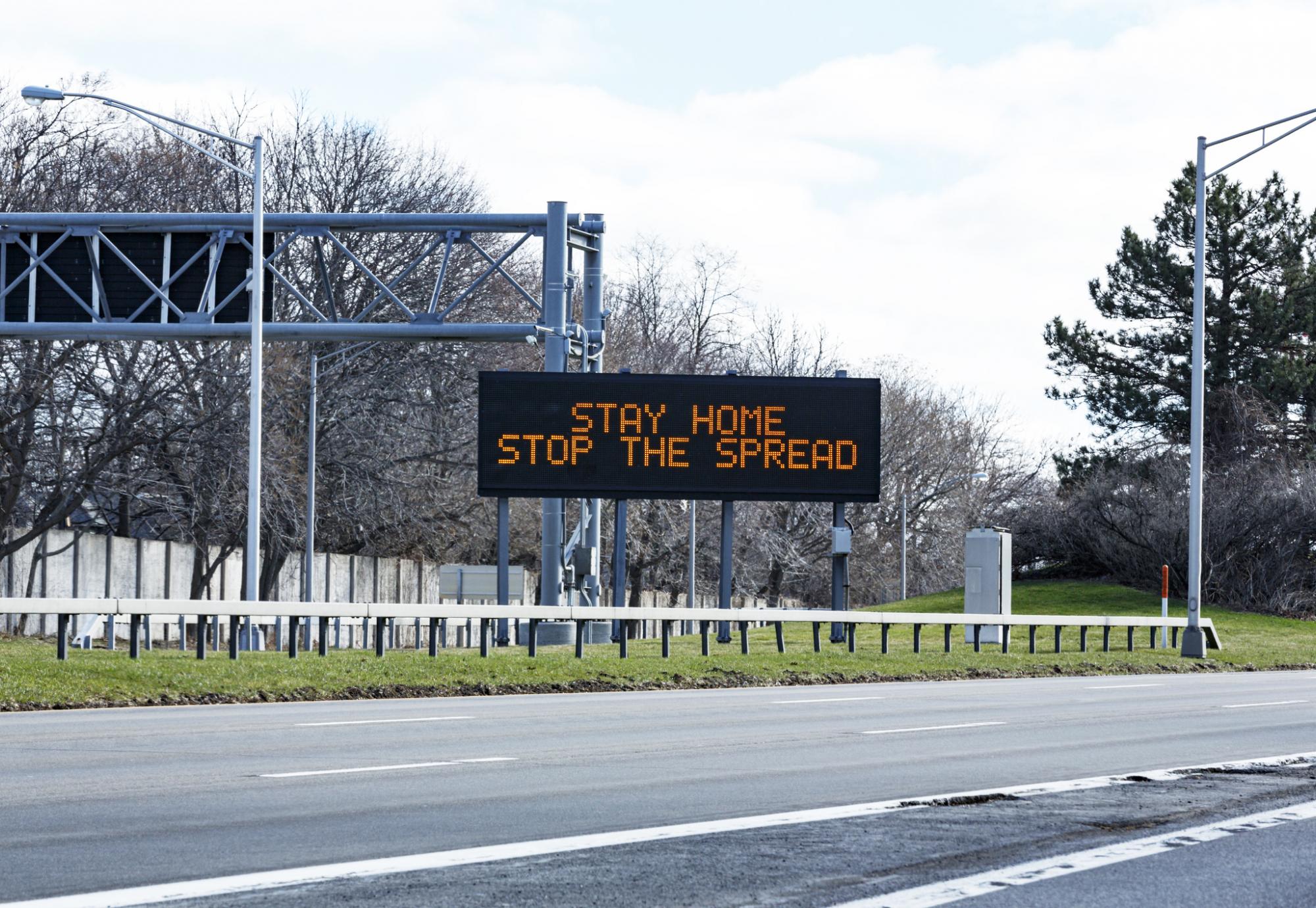 Stay home save lives sign