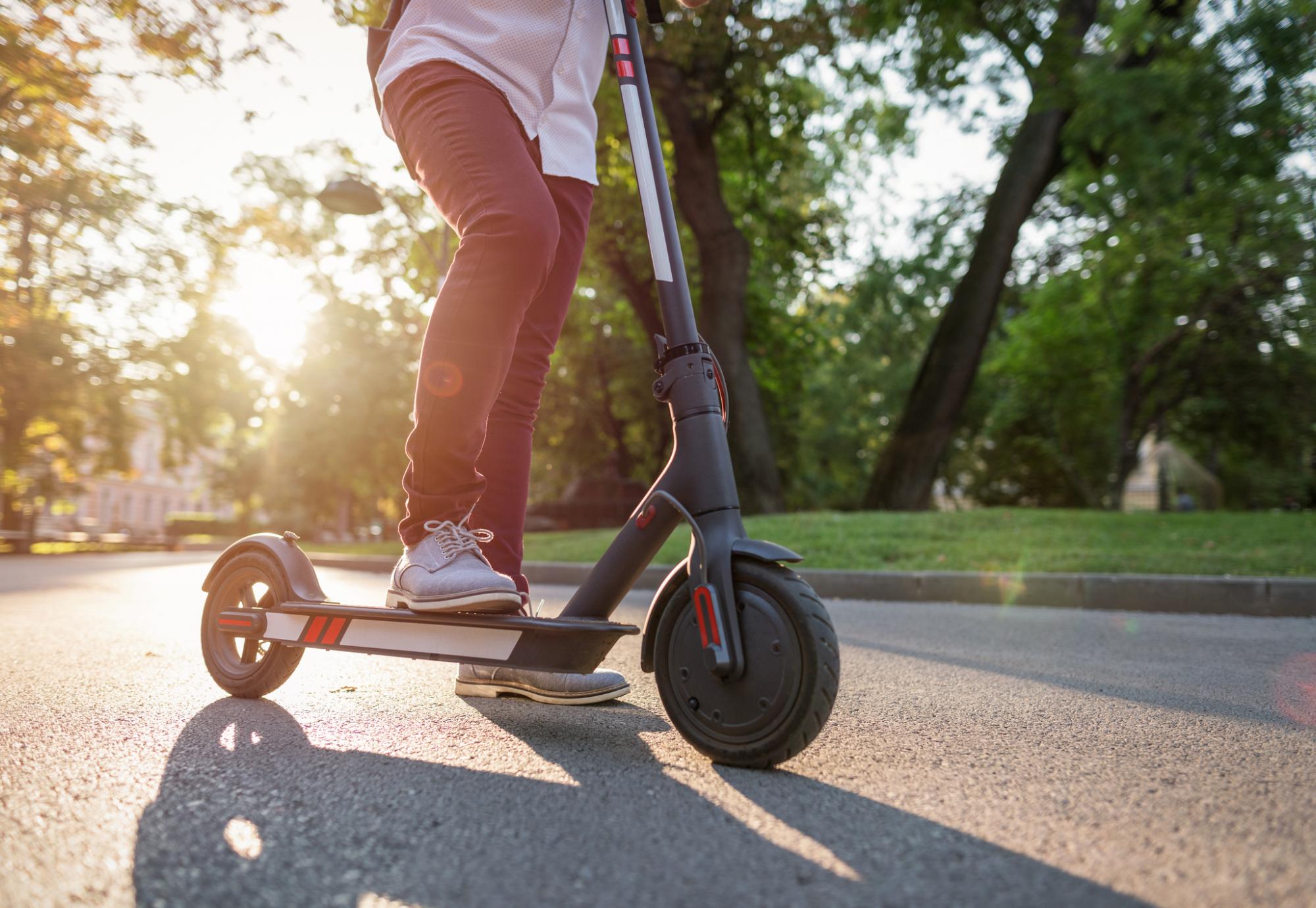 Man rides e-scooter