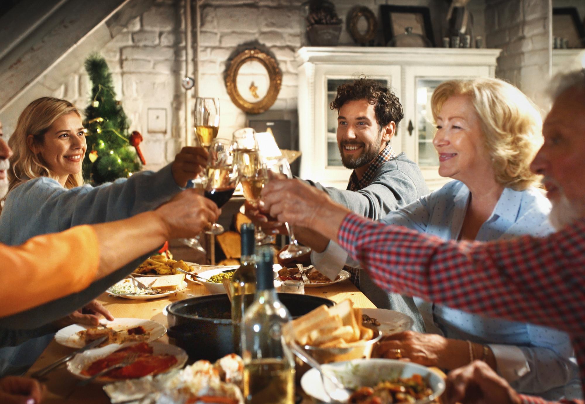 Family gathered around a dinner table at Christmas