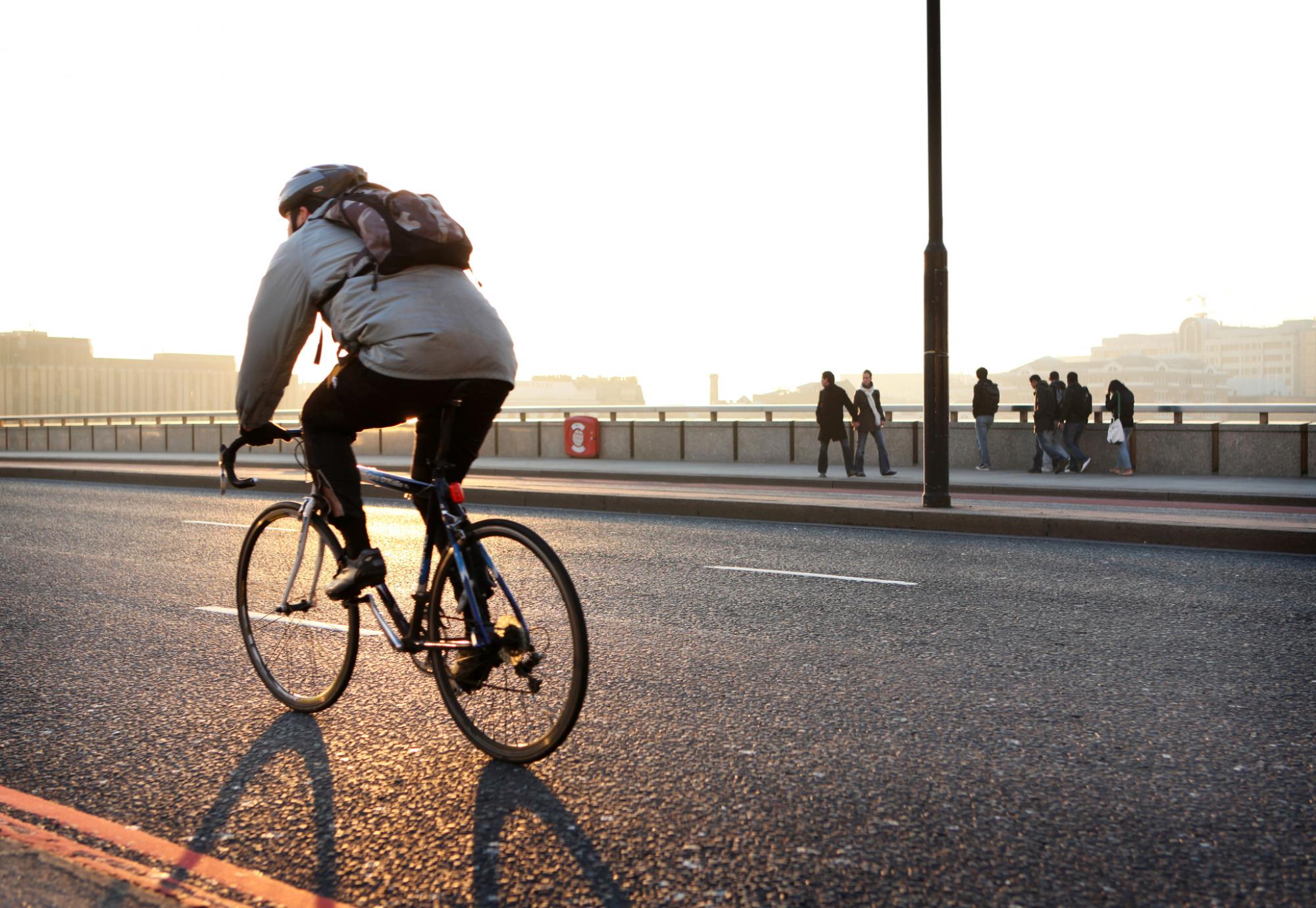 Man commutes to work on bicycle.