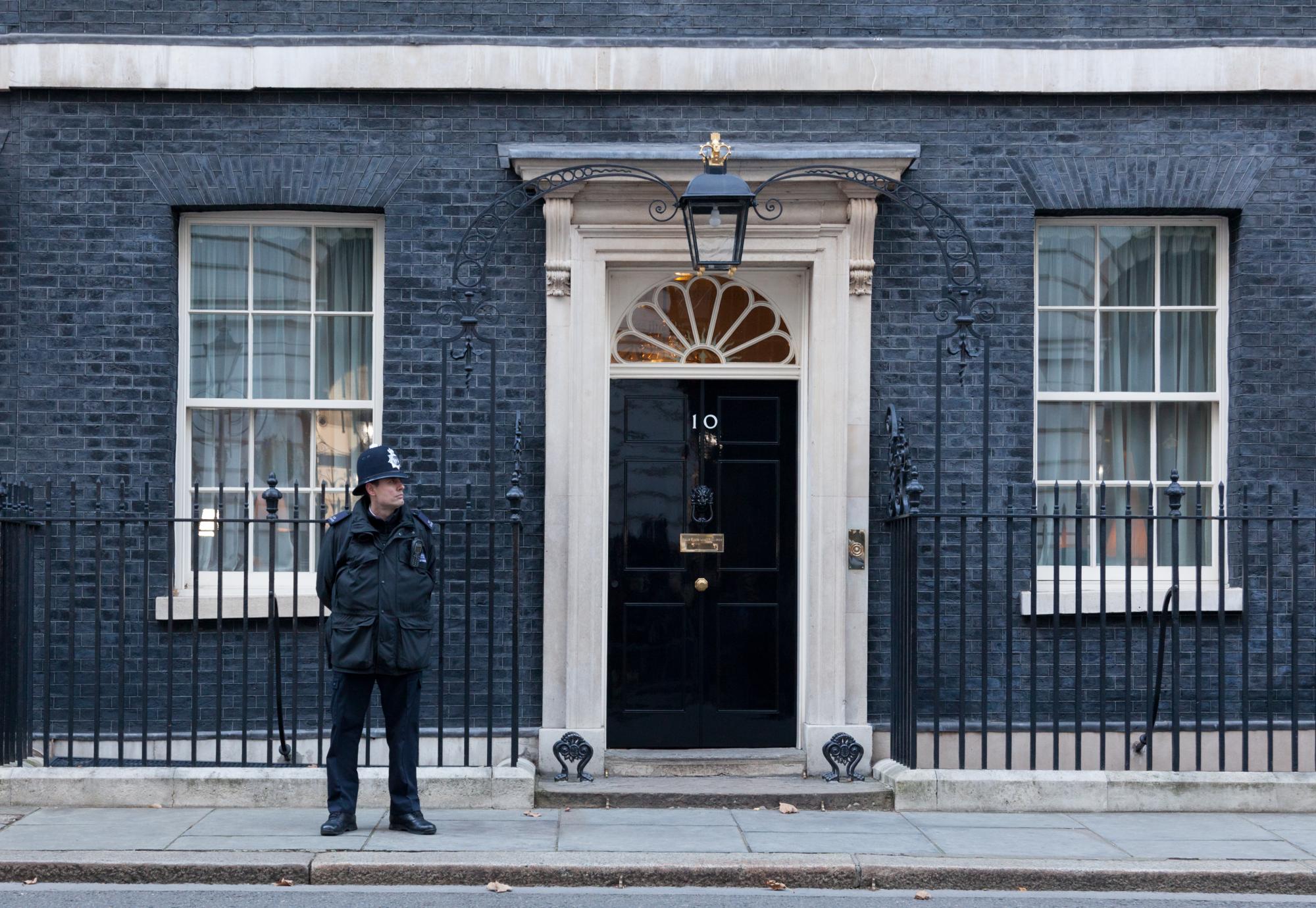 Policeman stands guard outside 10 Downing Street.