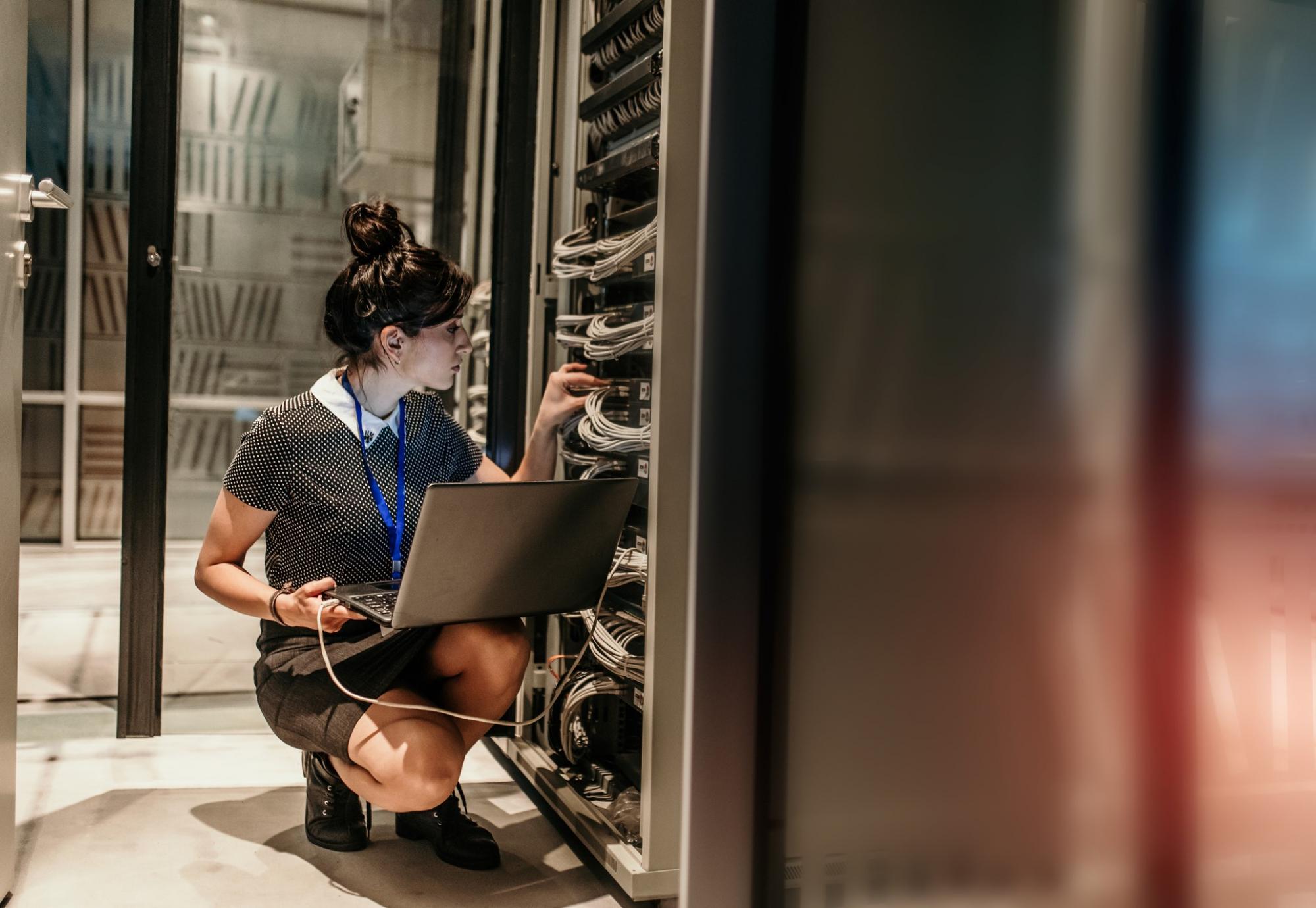 Technician in server room updating firmware.