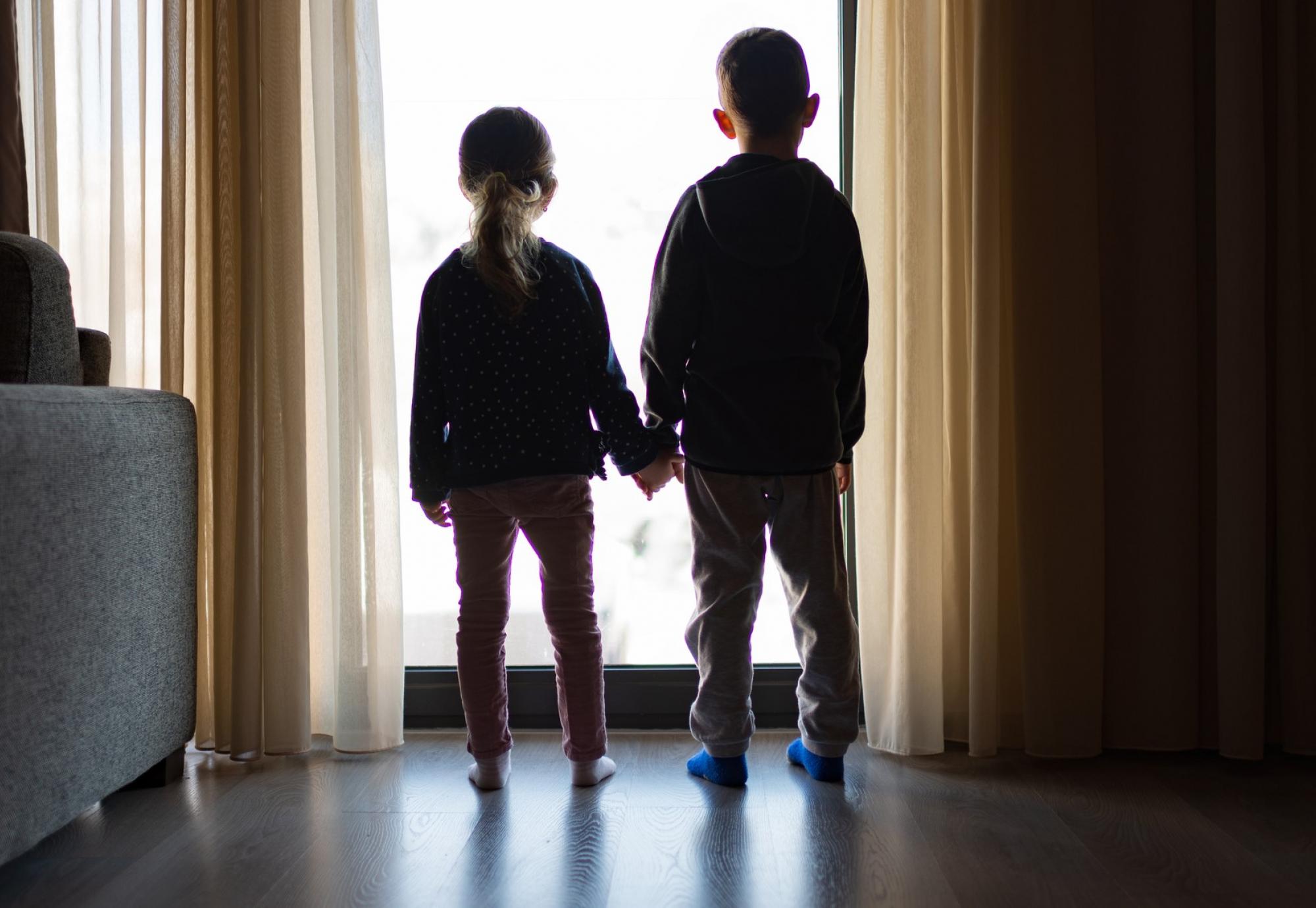 Children looking out the window 