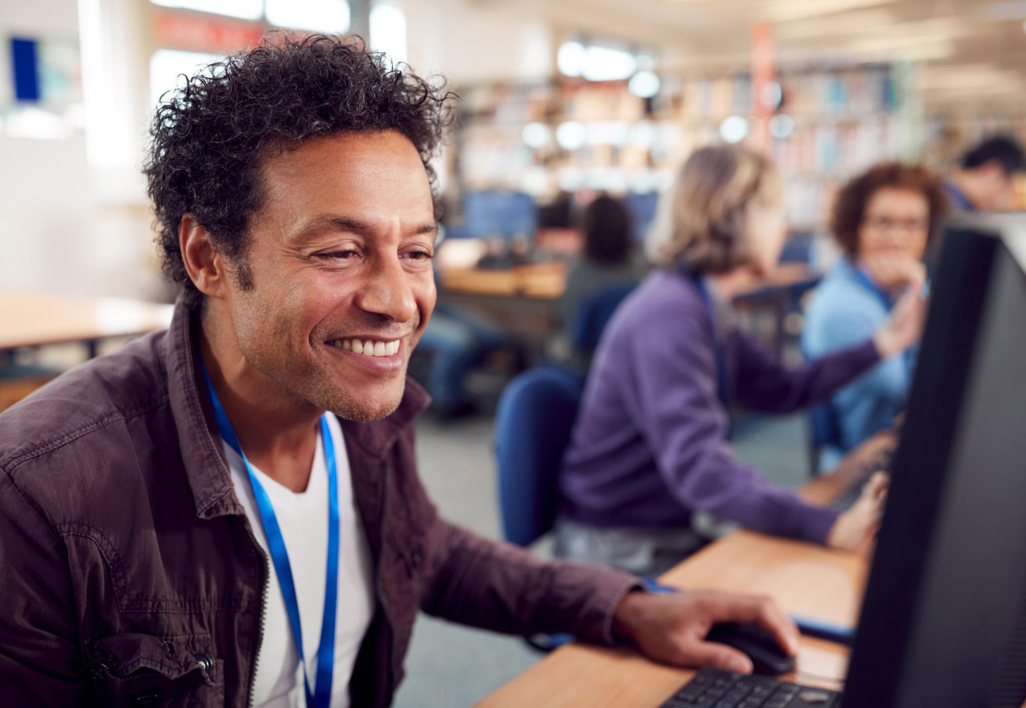 Mature student learning on a computer. 