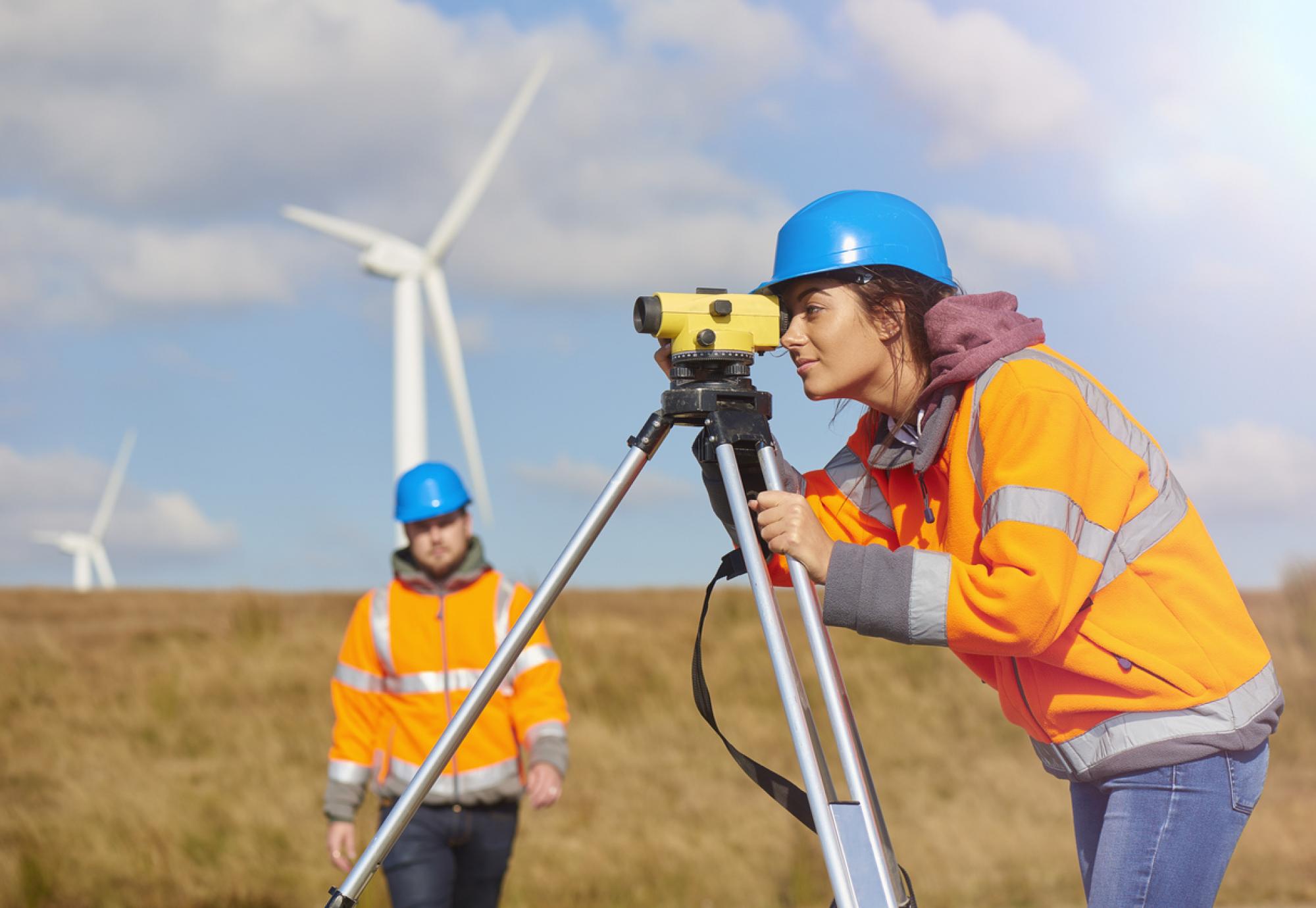 Engineers use surveying tools. 