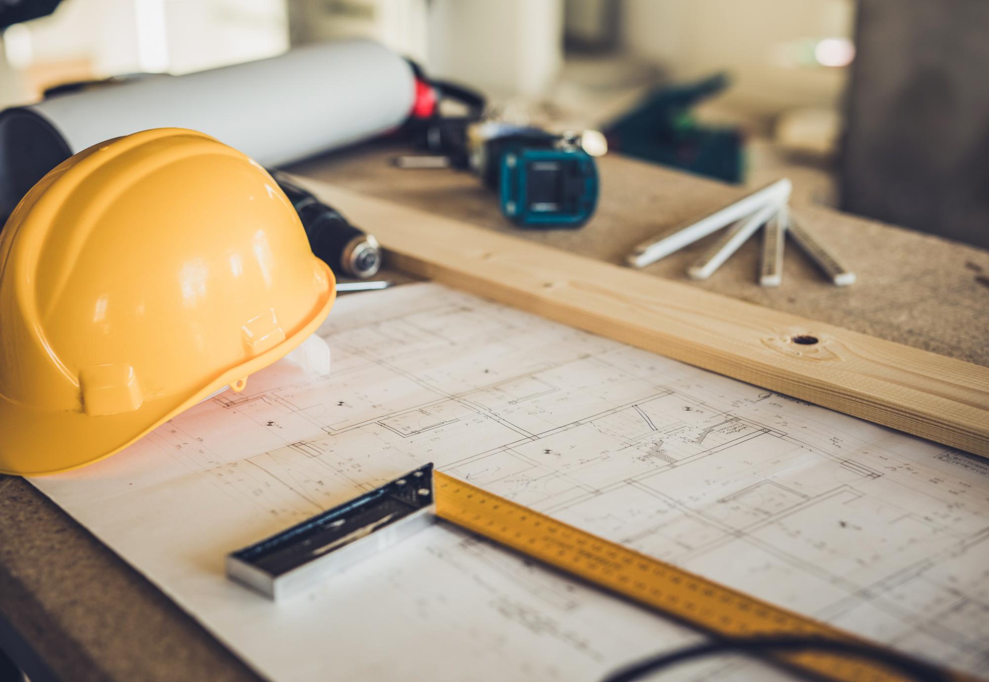 Hard hat and assorted construction items on a table