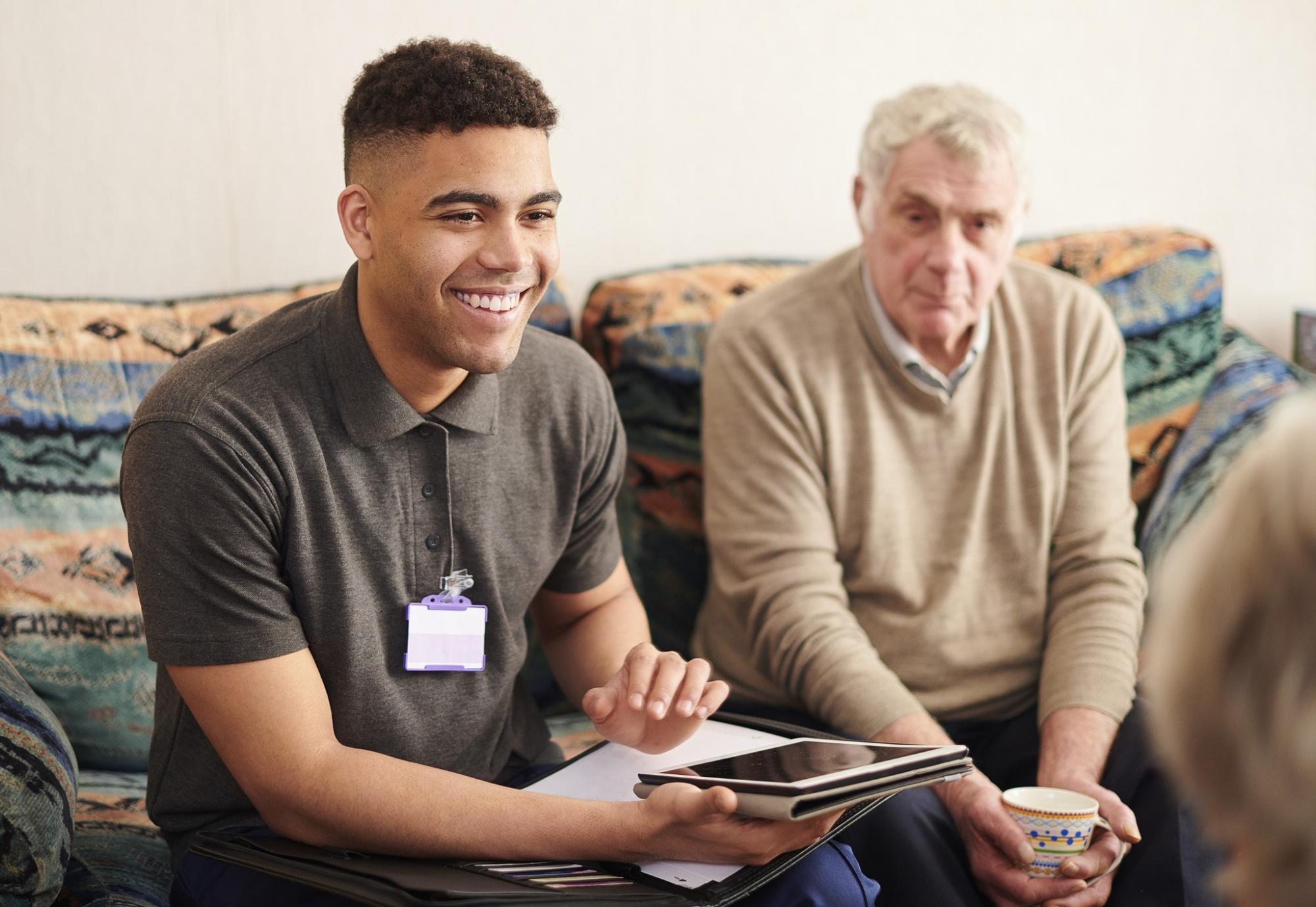 Social care worker talking with a family