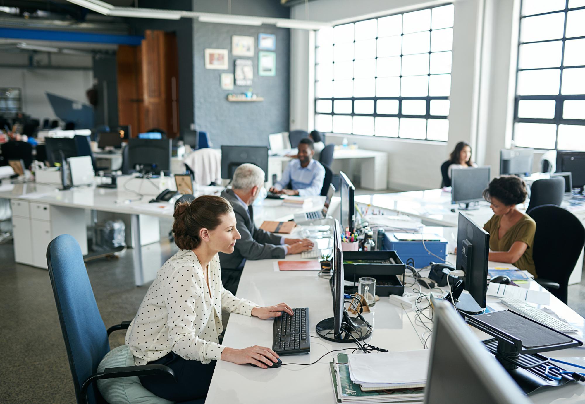 Office workers in an open plan space