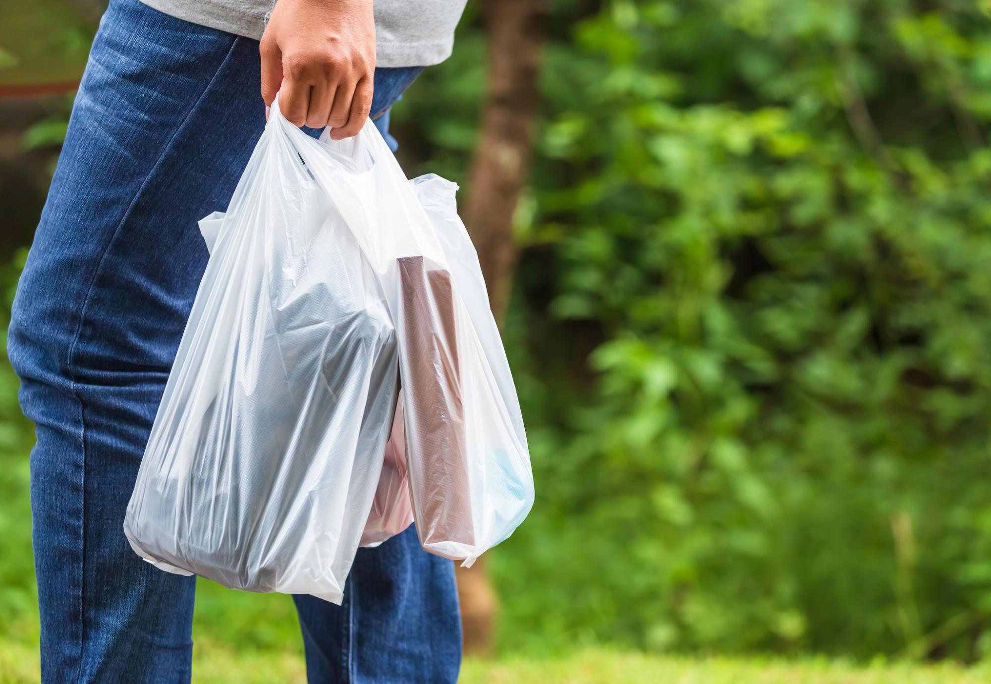 Woman holding plastic bags