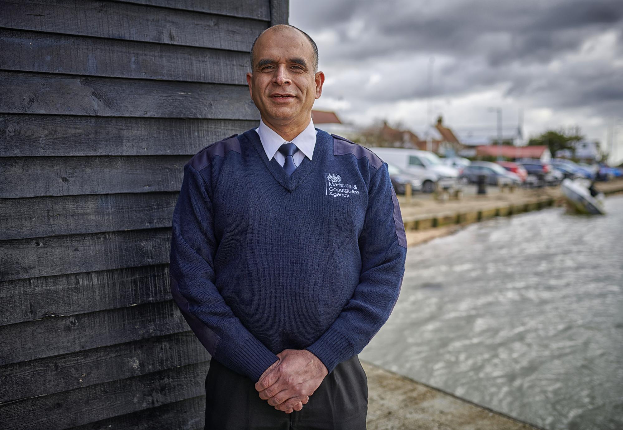 Public service worker stood on a dock