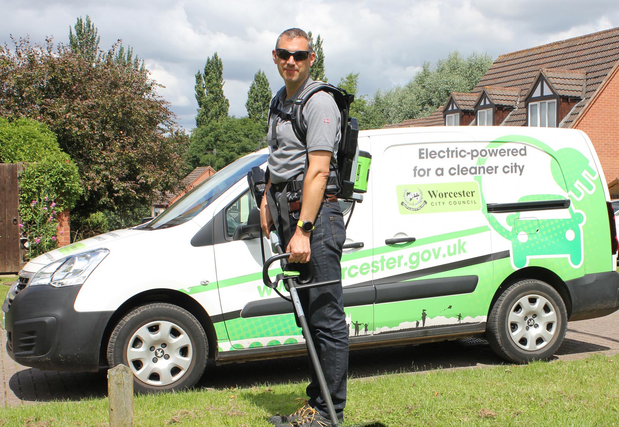 Councillor Andy Stafford with the electric grass strimmer