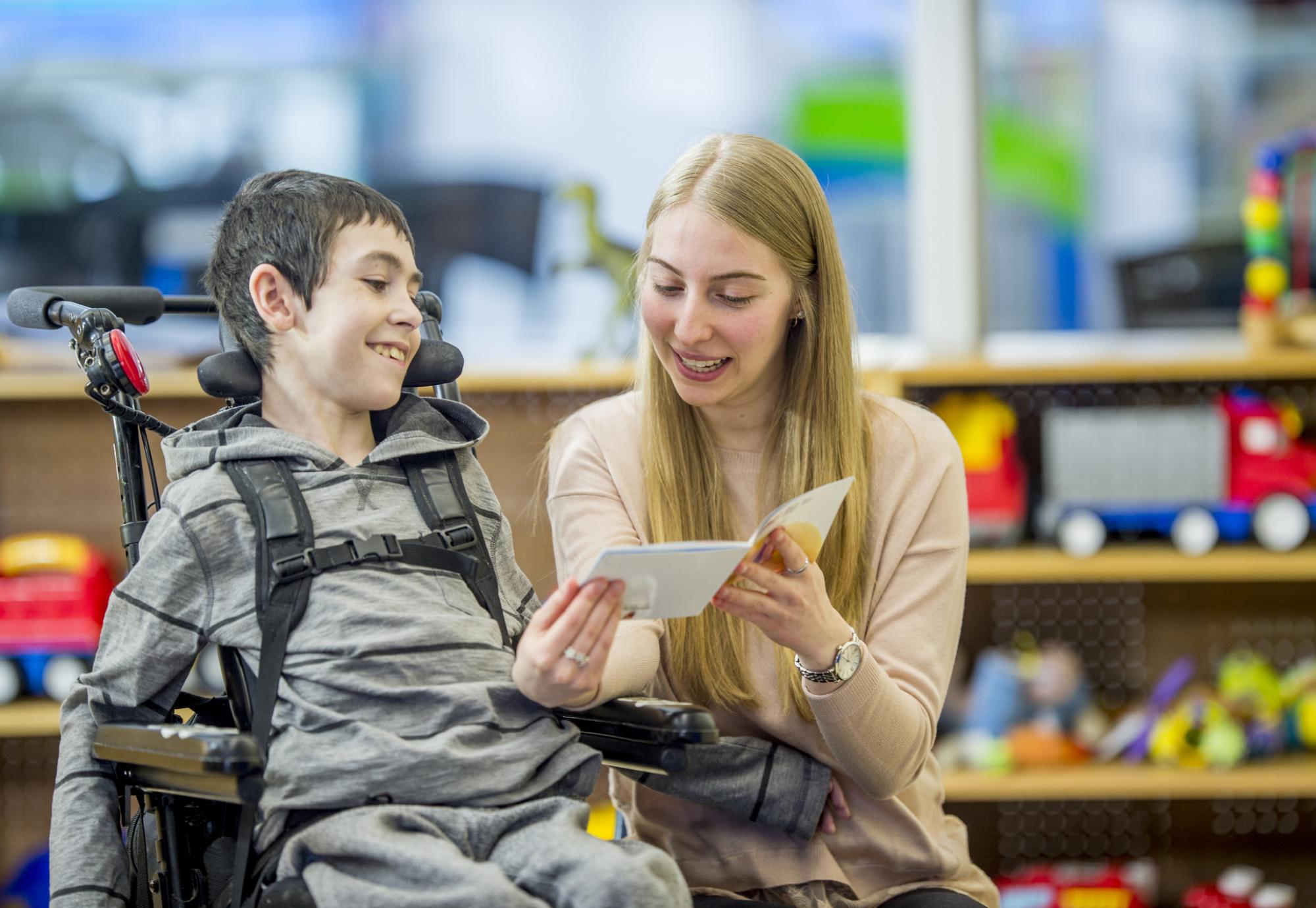 Learning disabilities worker helping a child