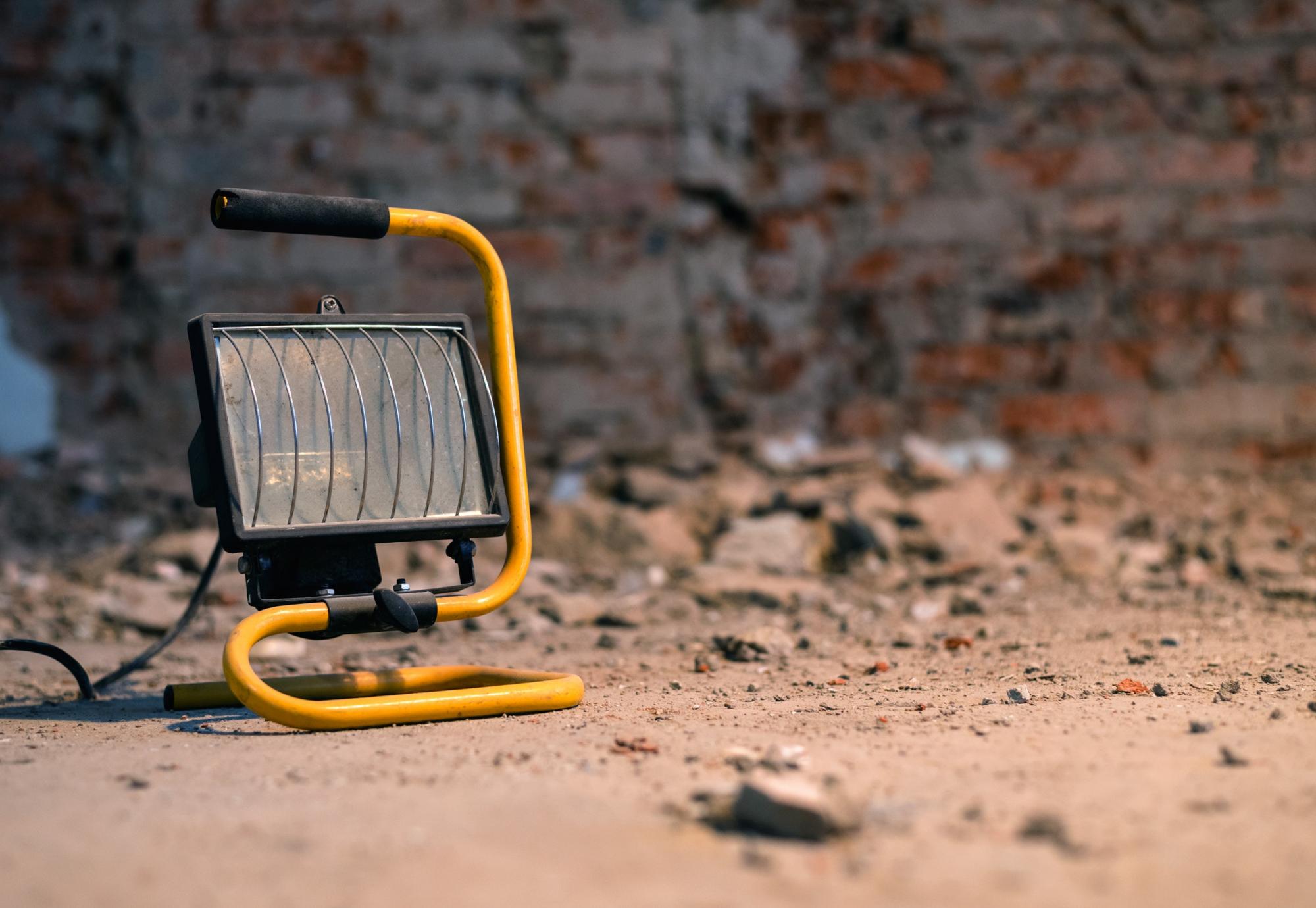 Handheld construction lamp at a building site