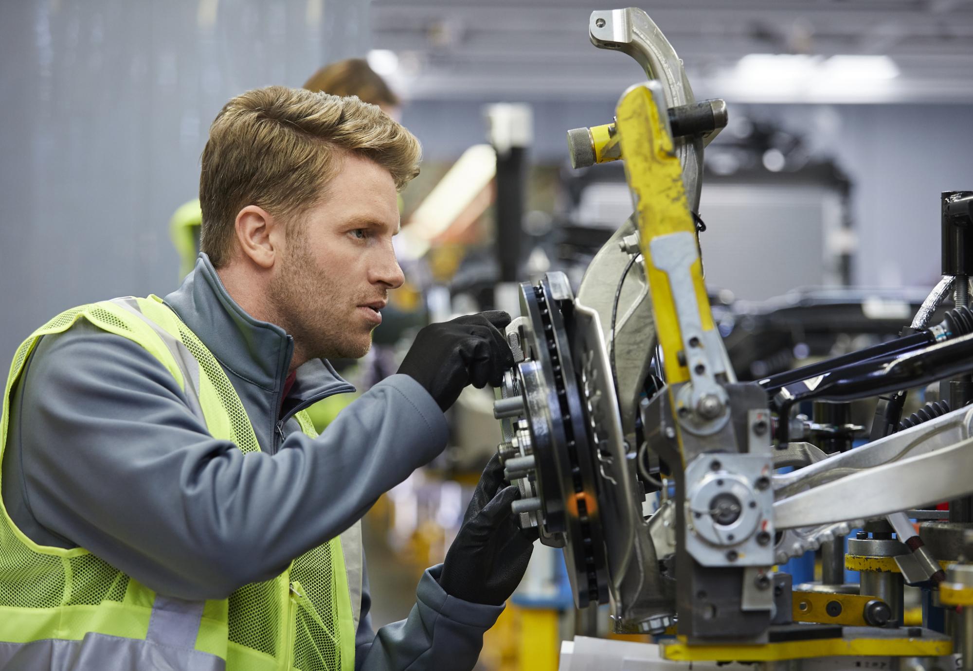 Man working on a car manufacturing plant