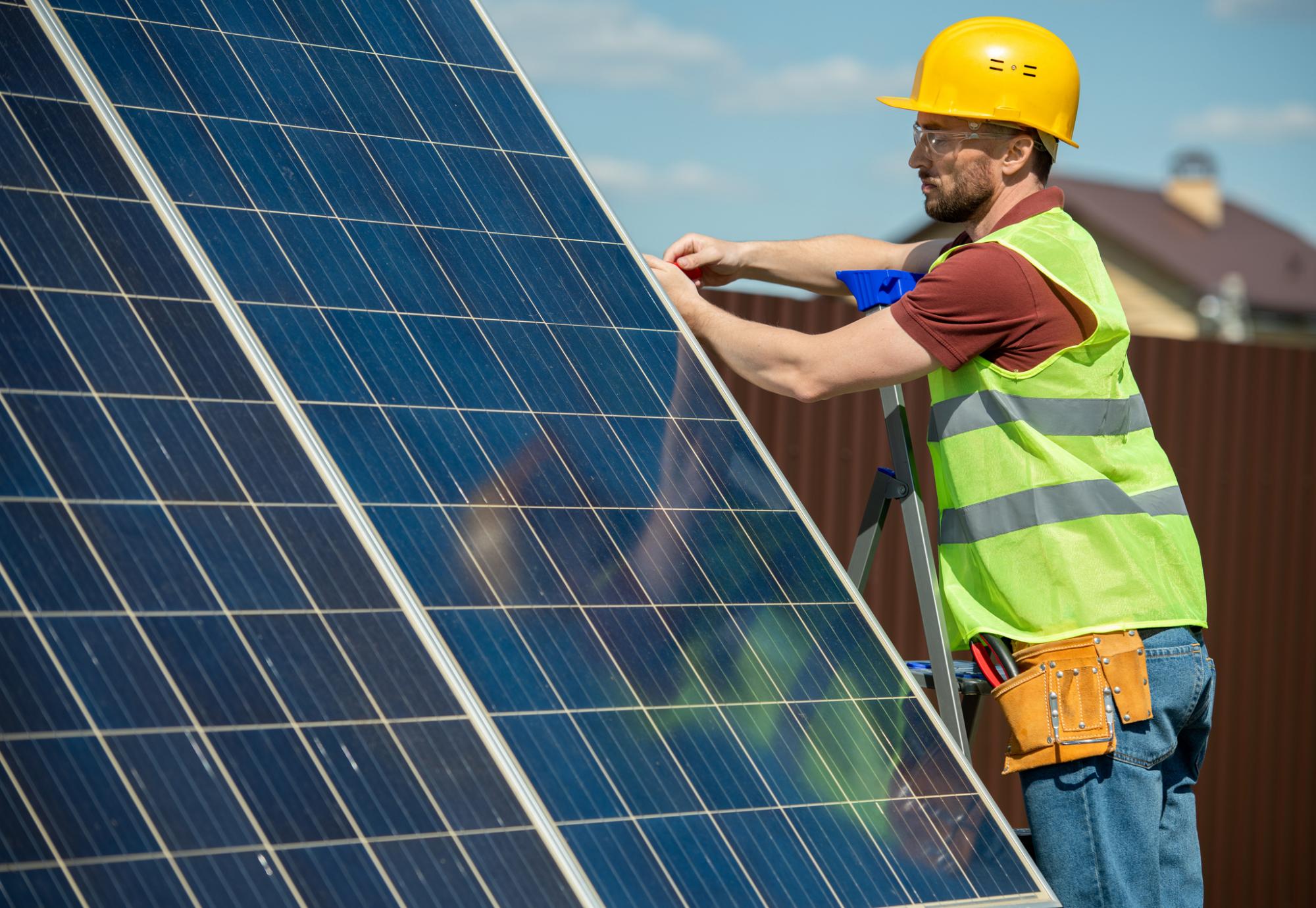 Engineer installing solar panels