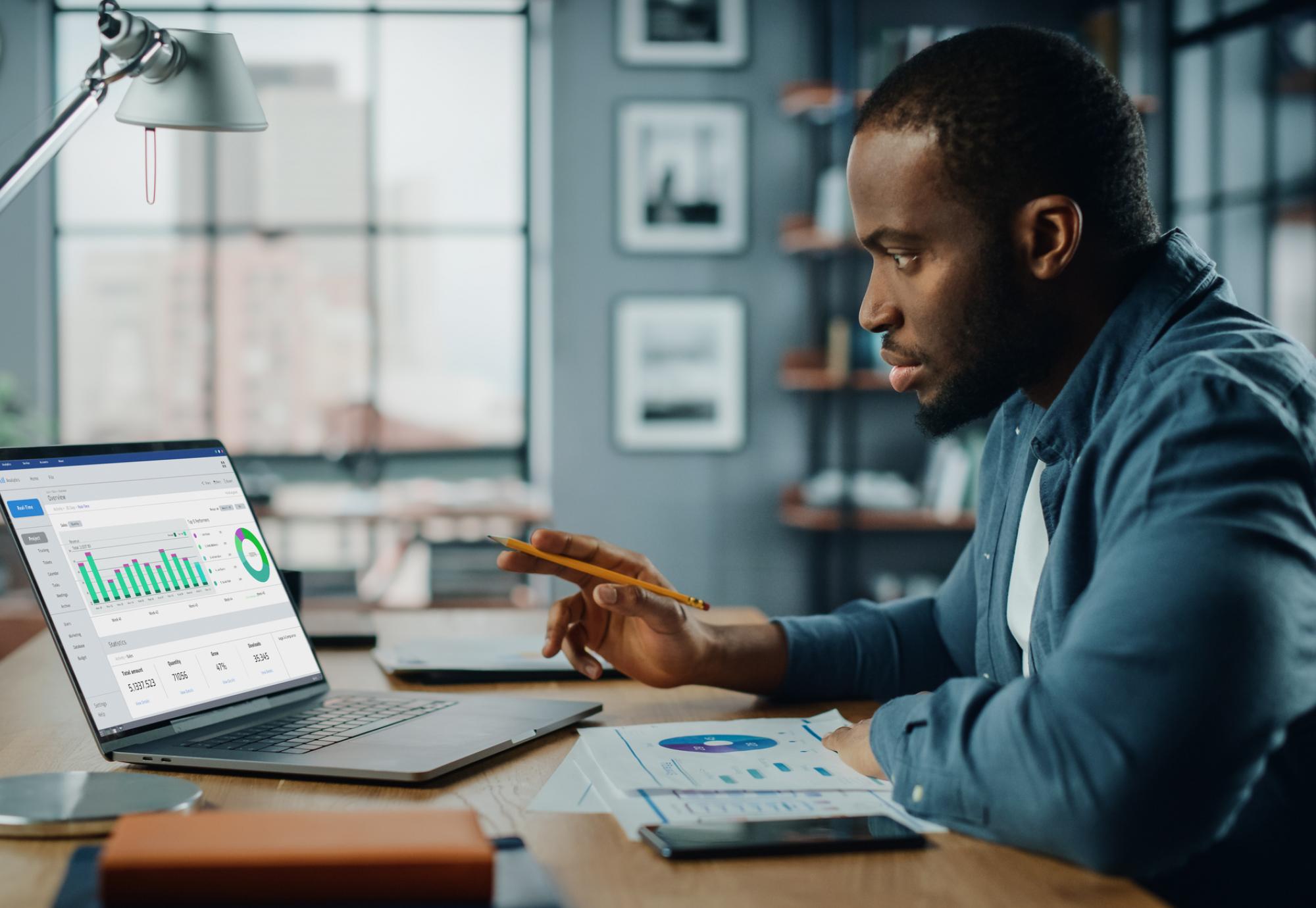 Man at a computer analysing data