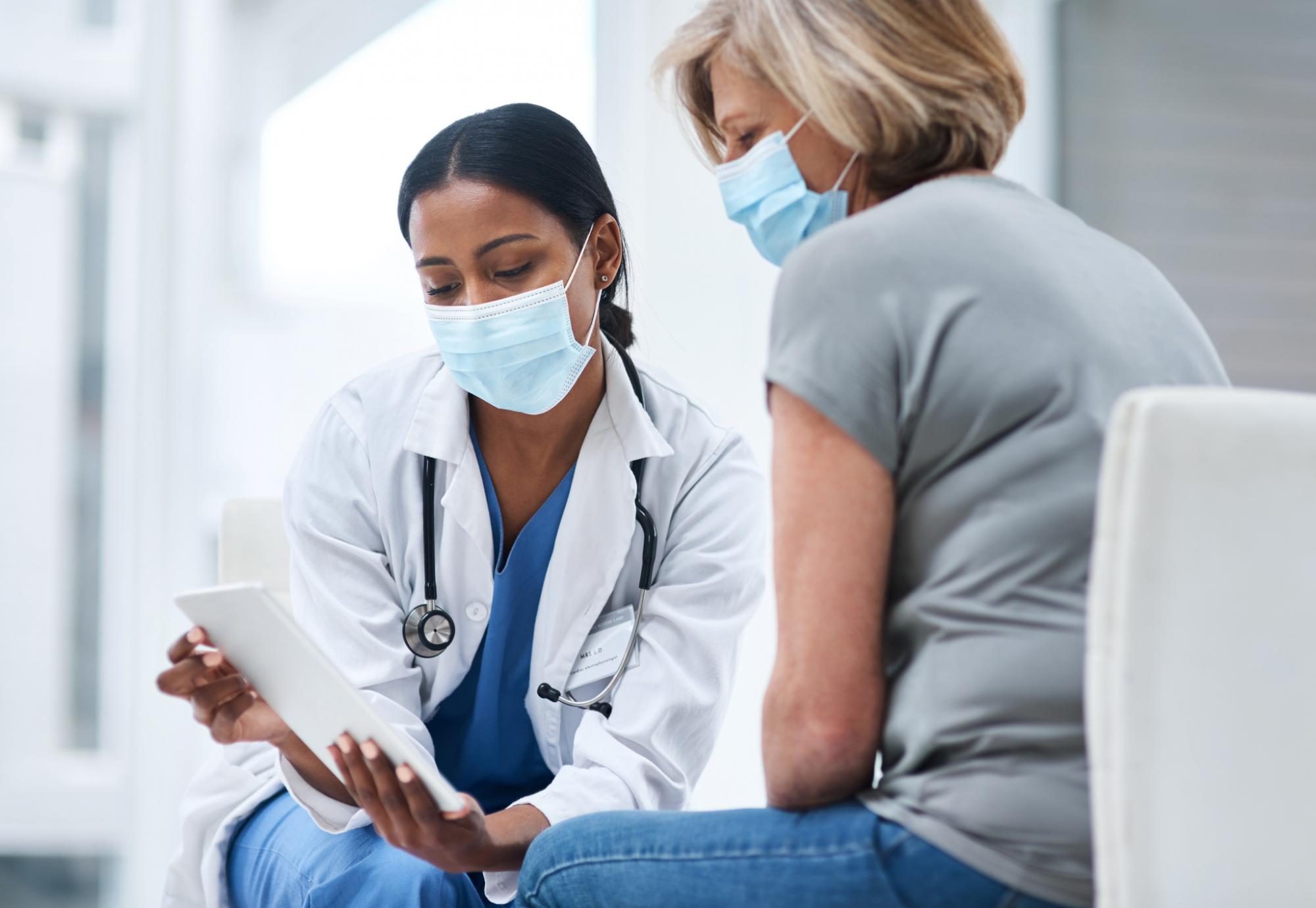 Health worker with woman