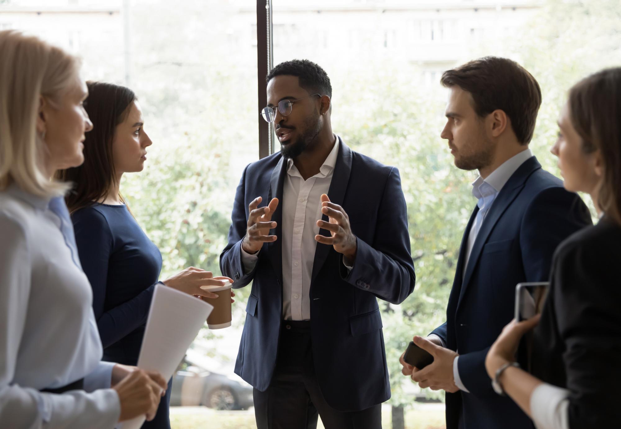 Leader speaking to colleagues