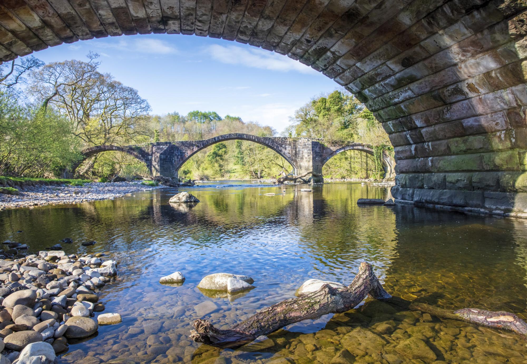 View of a river from underneath a bridge in Lancashire