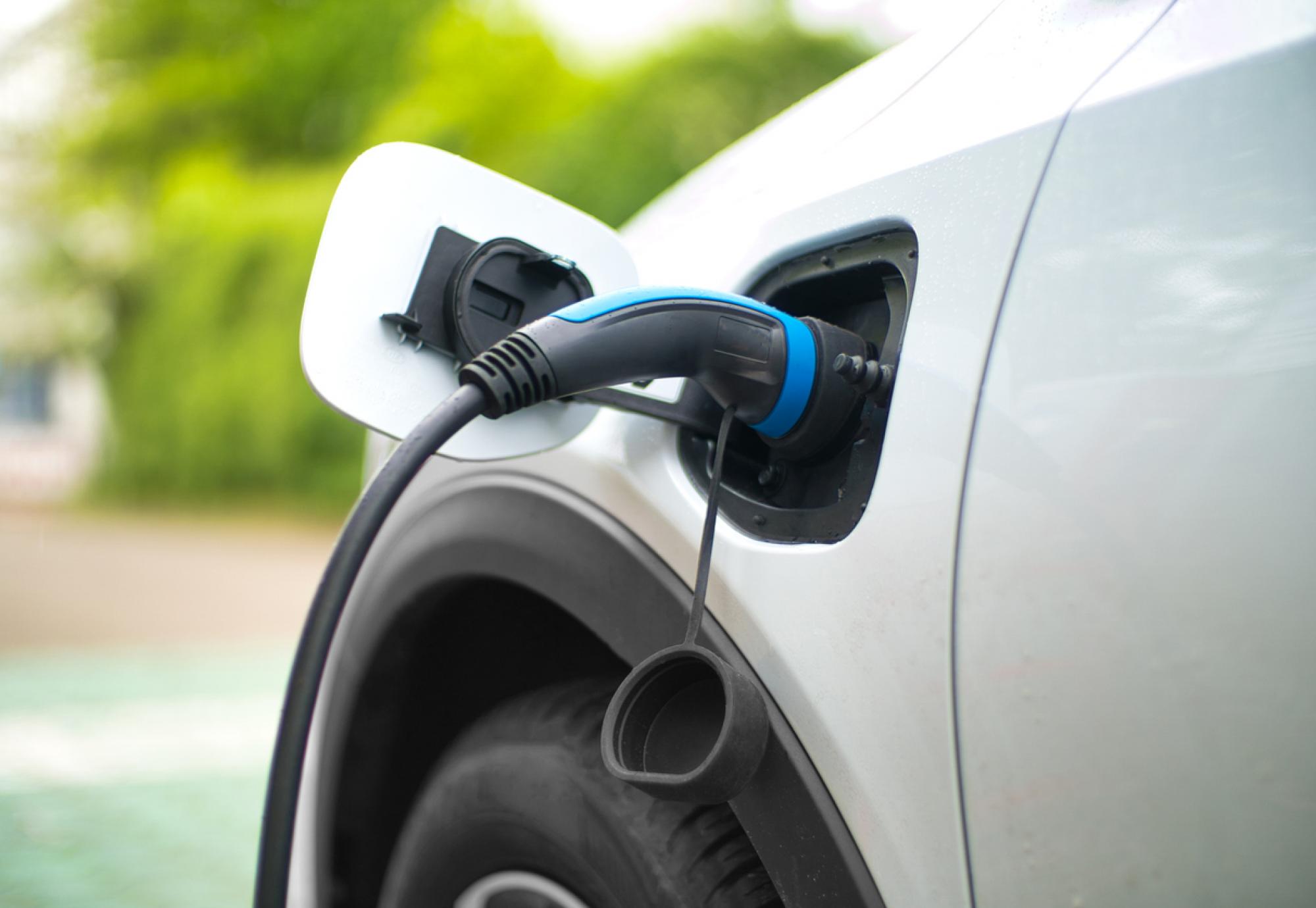 Electric Car Charging At Power Station