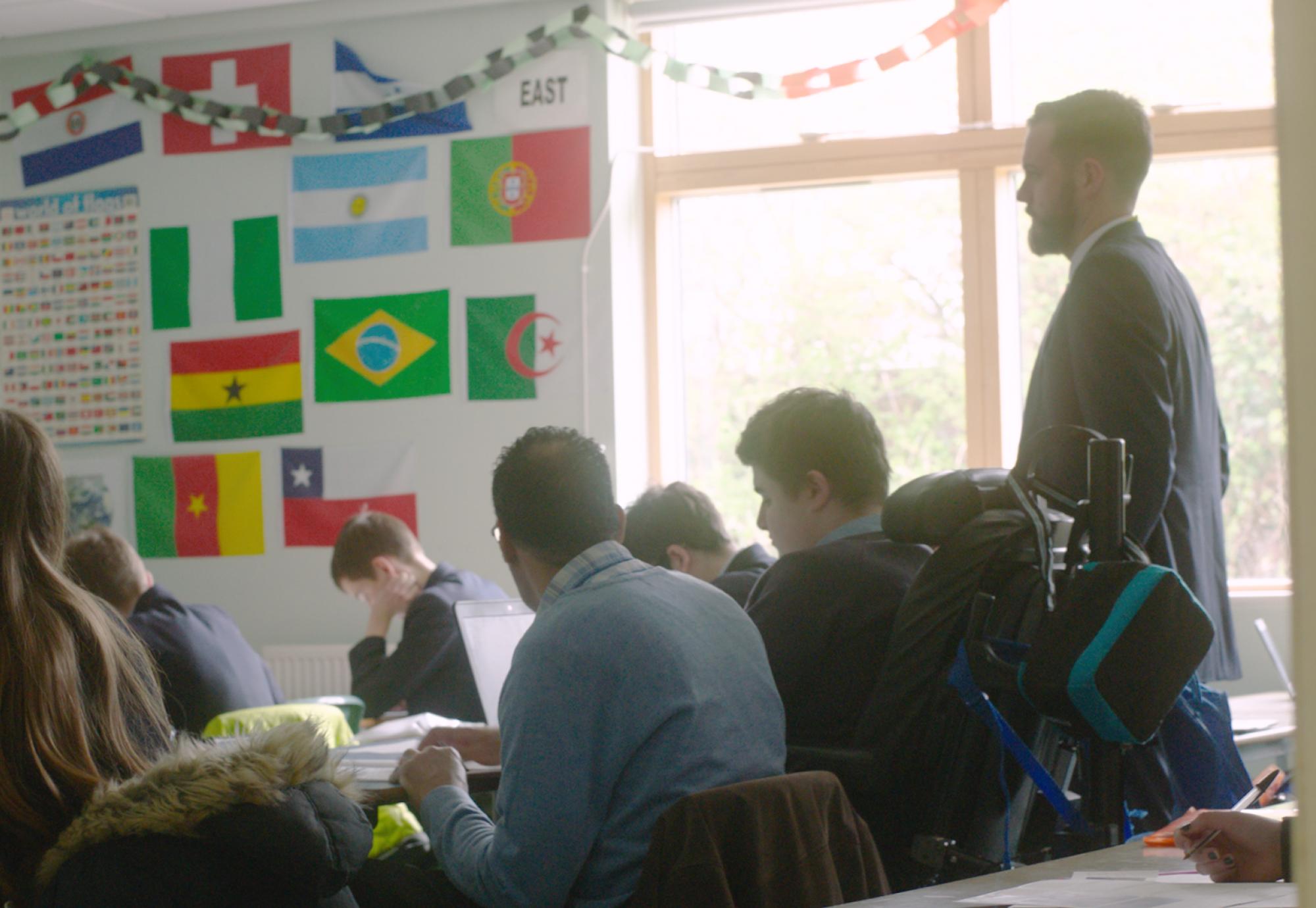 A teacher in a classroom with students