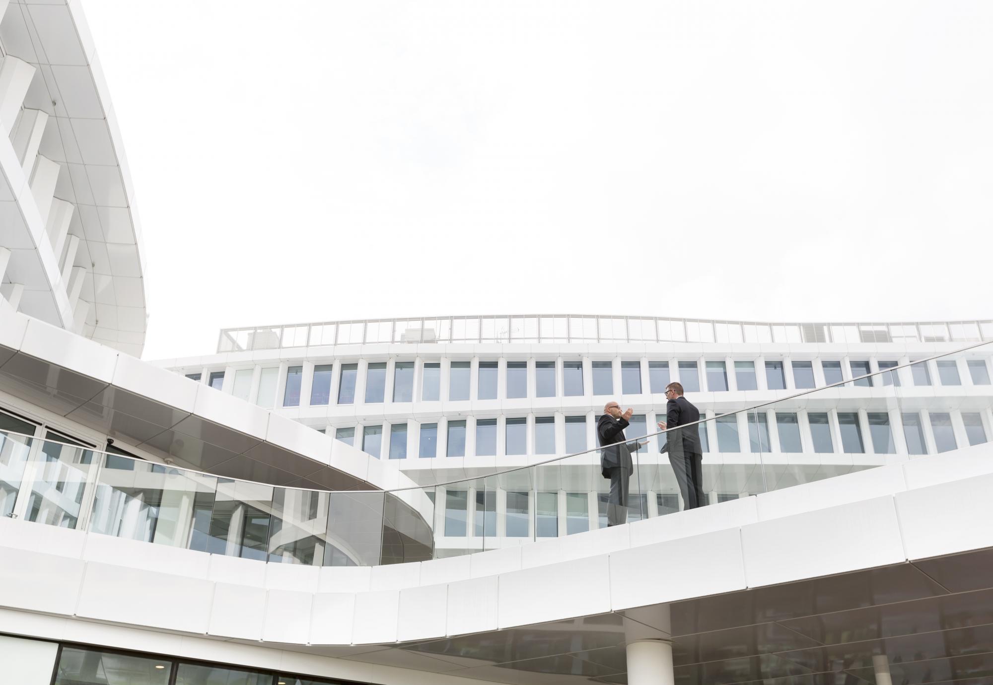 Two people stood outside a modern building