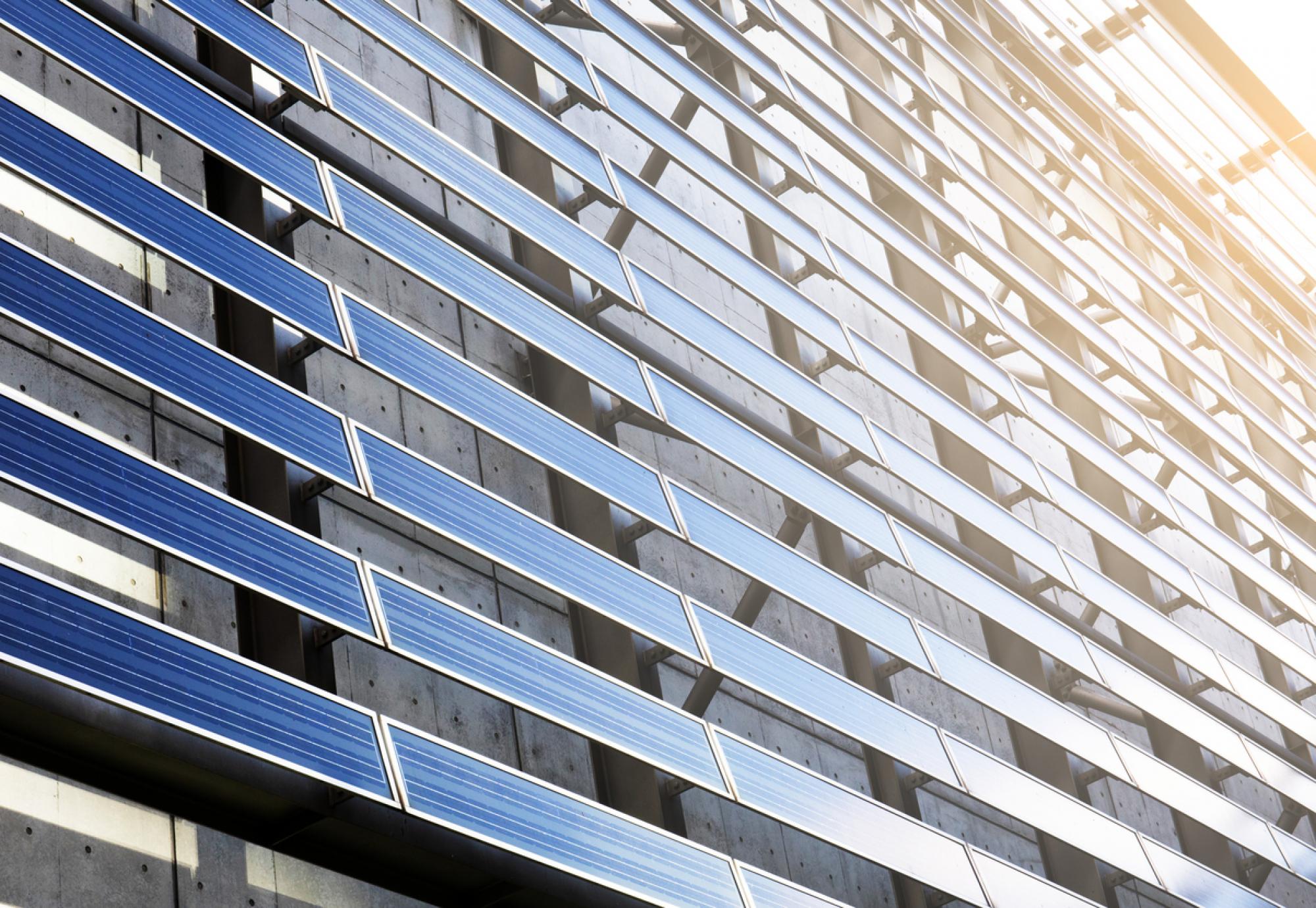 Solar panel on the side of a building on a sunny day