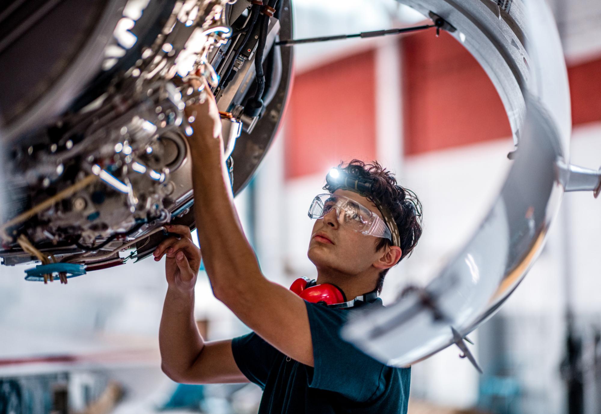 Male engineer working on an engine