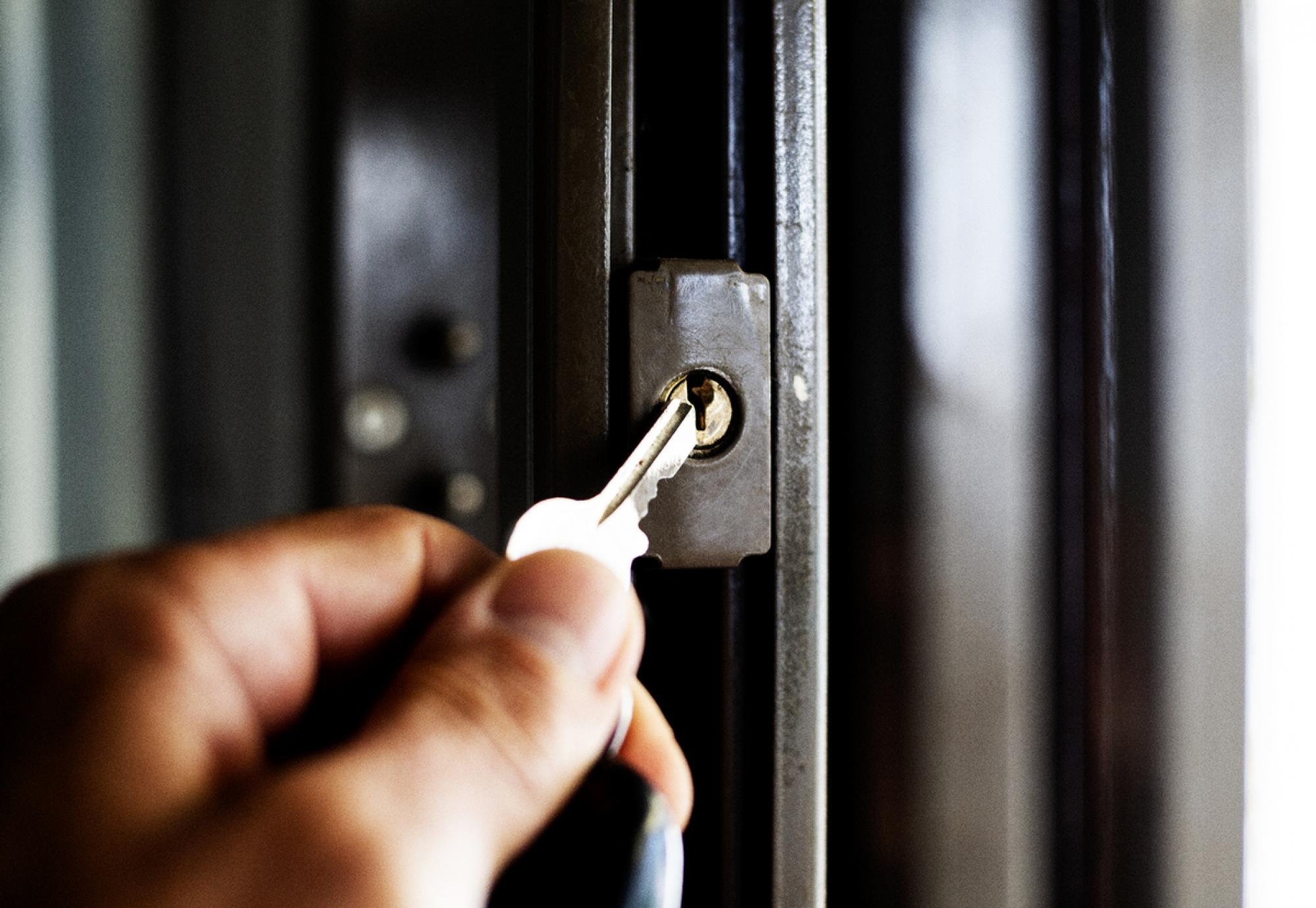 A key being put into a door