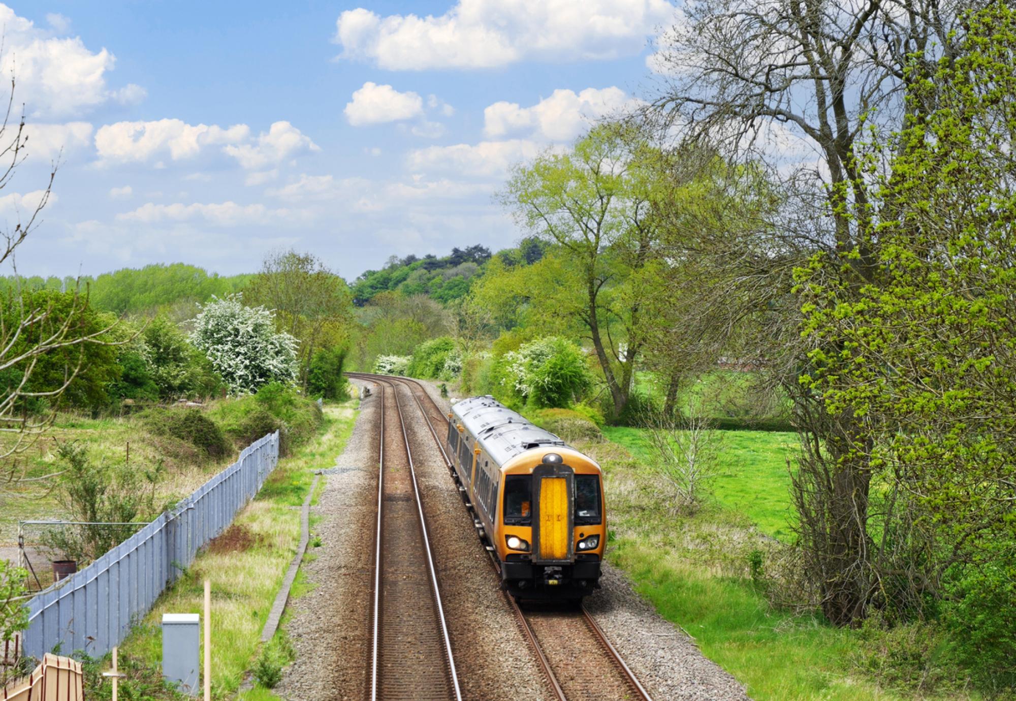 Aerial view of a train on a track in the countryside