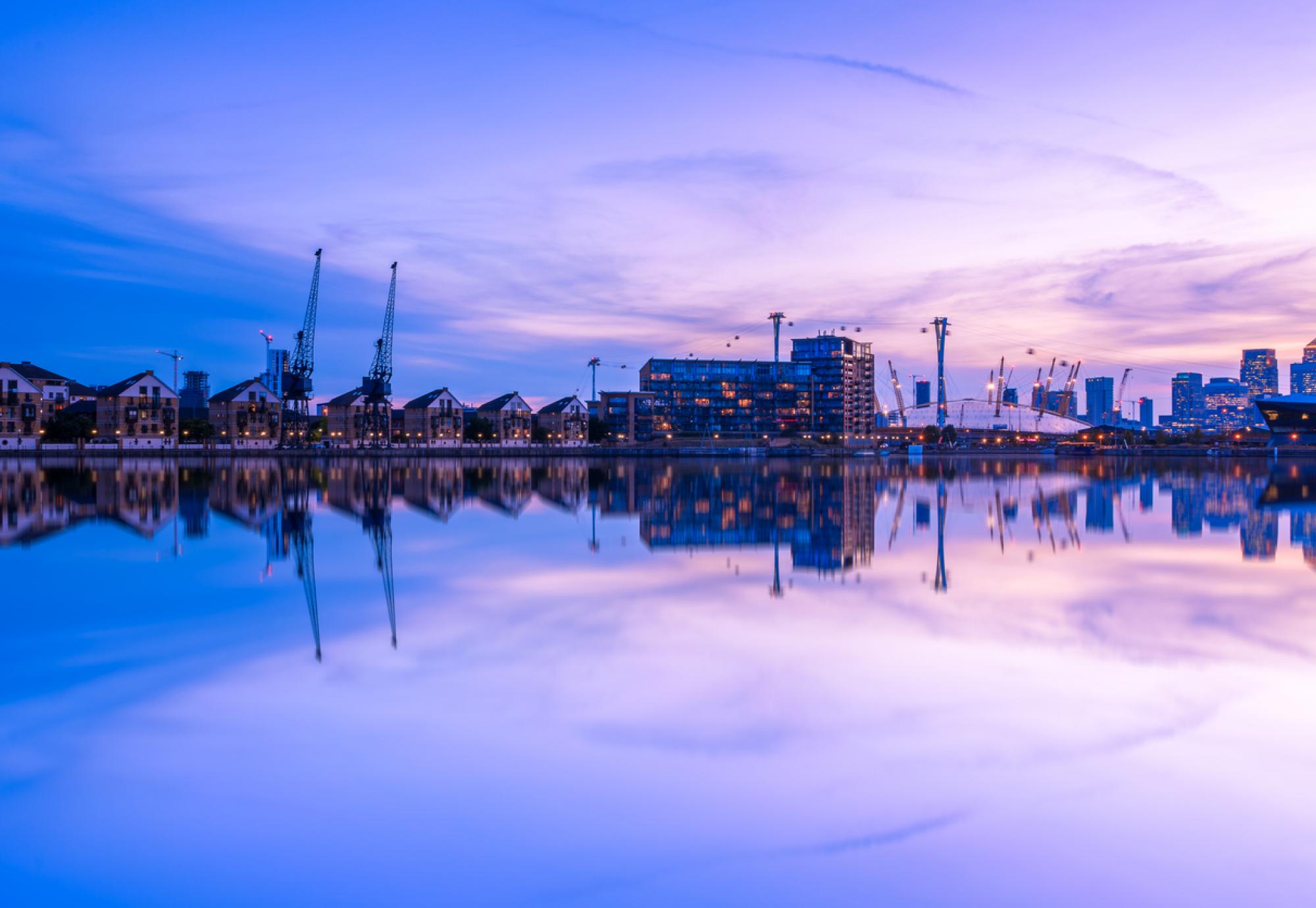 Dusk view of Royal Victoria Dock, with Canary Wharf in the background